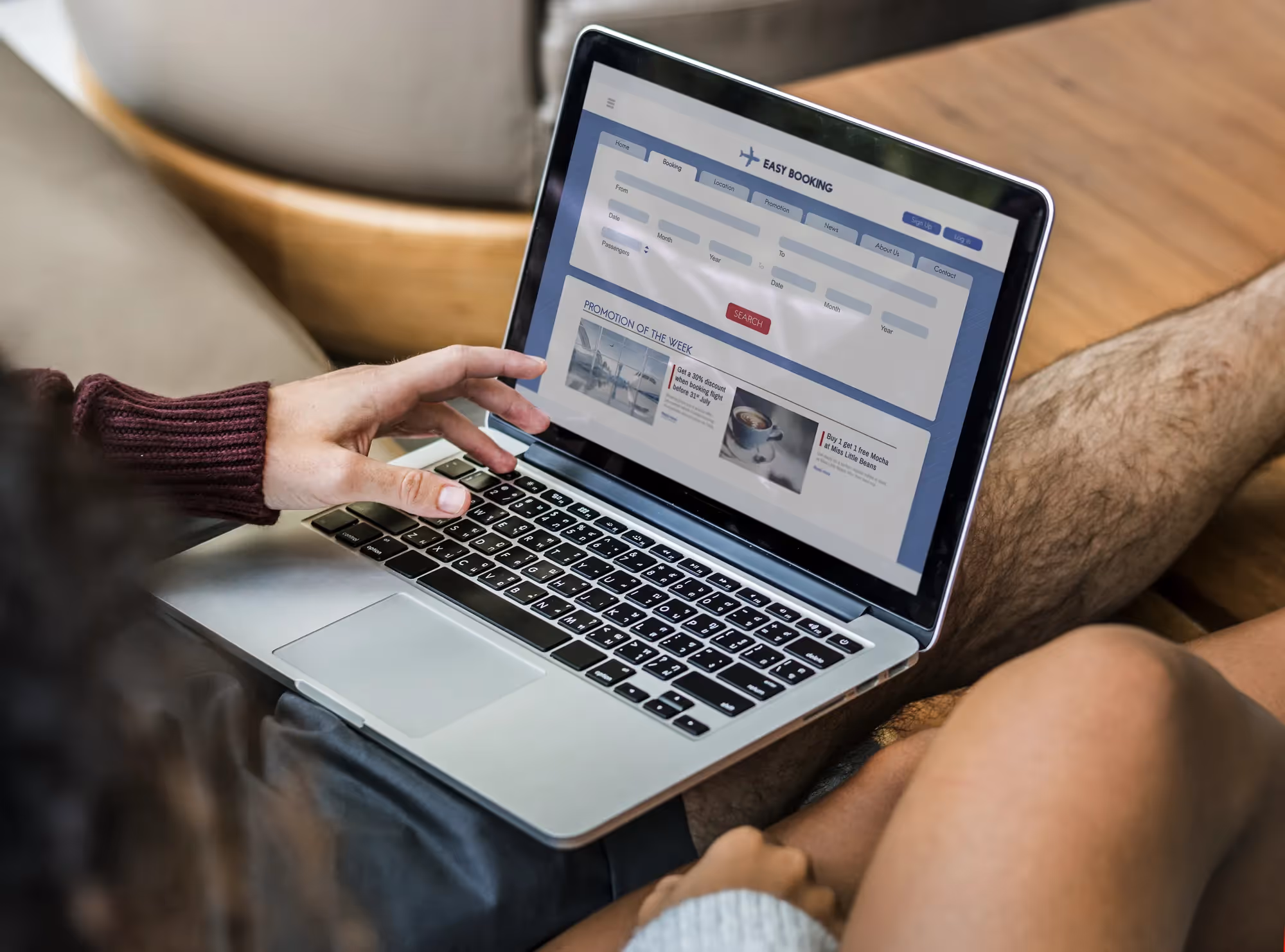 A laptop with a website open to a page about vacation rentals.