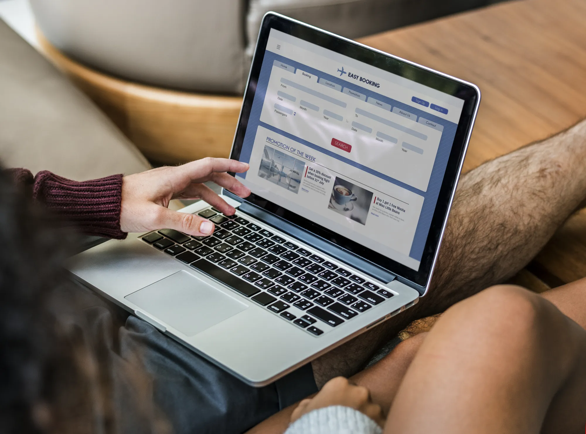 A laptop with a website open to a page about vacation rentals.