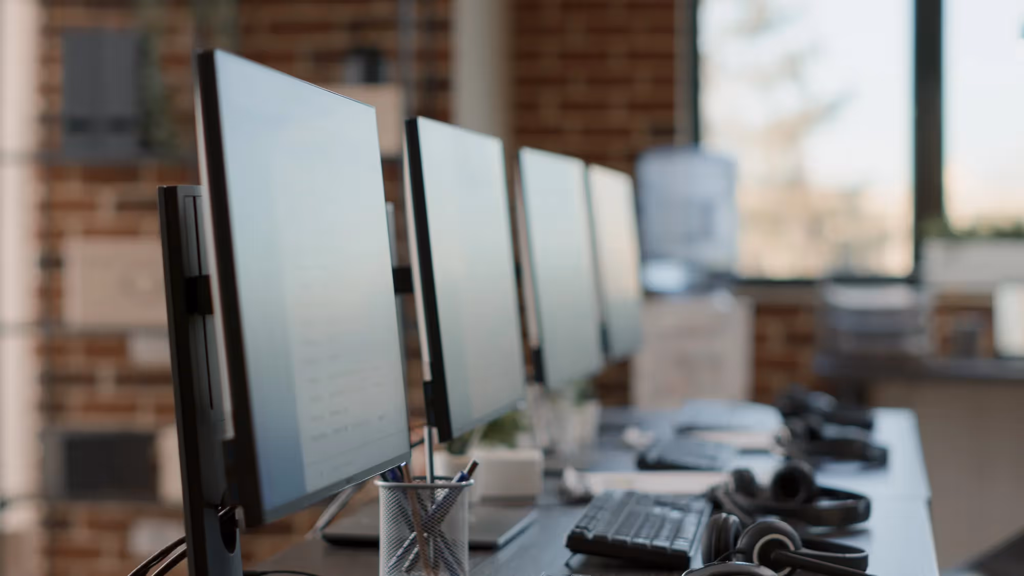 A computer monitor with a keyboard and mouse in front of it.