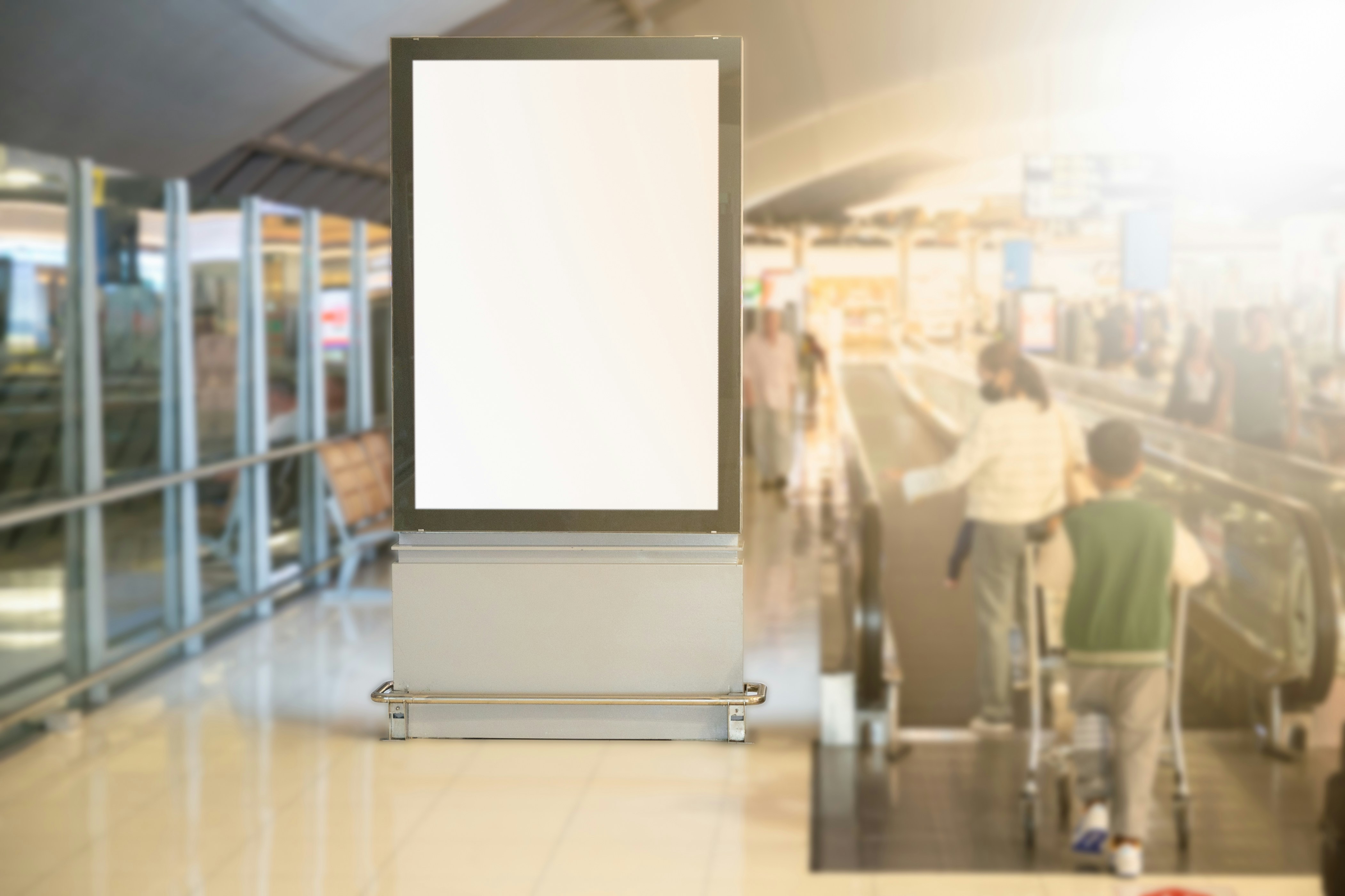 A large screen with a blank white background in a mall.