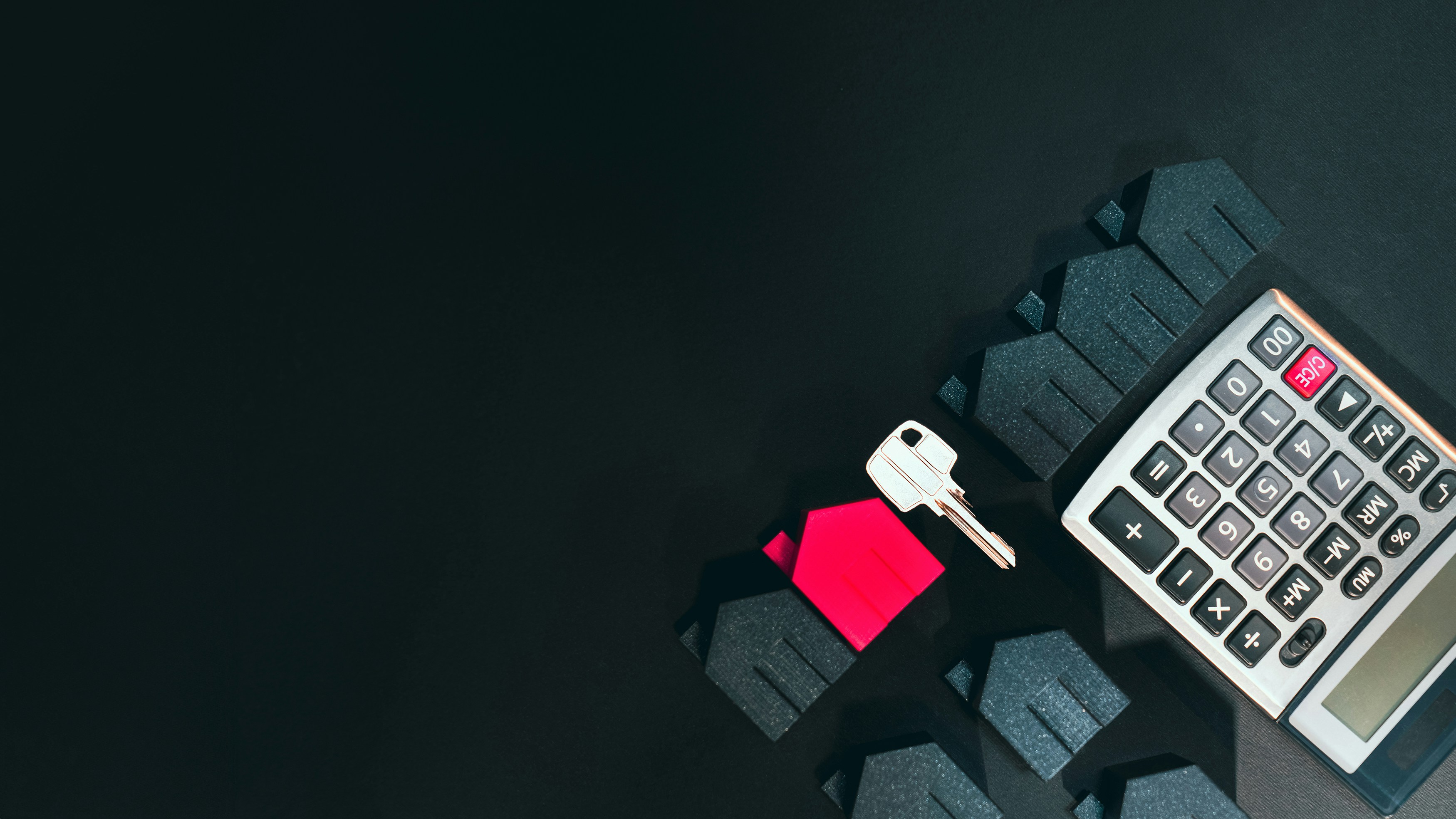 A black background with a key and a calculator.