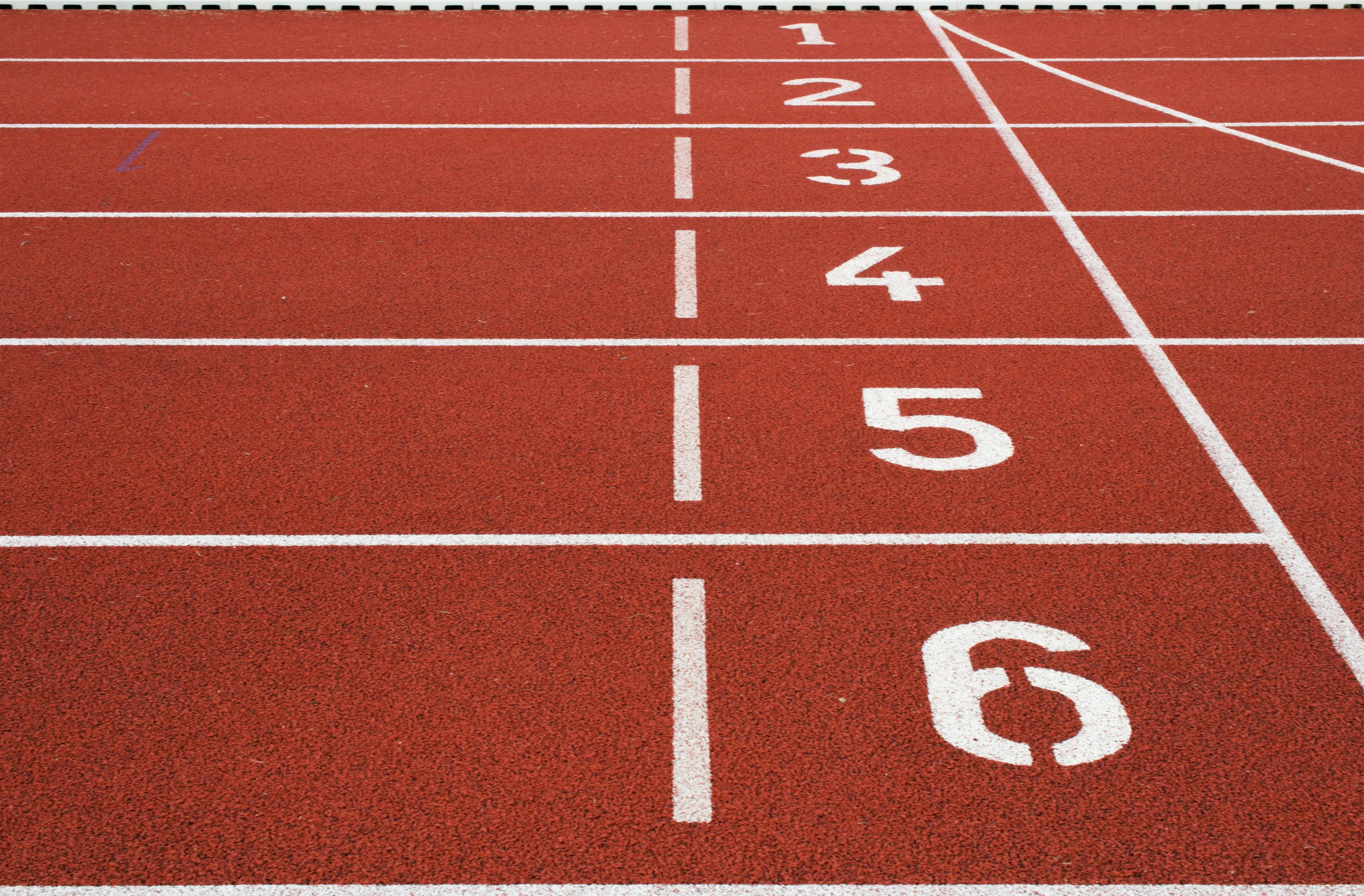 A white number 6 on a red track.