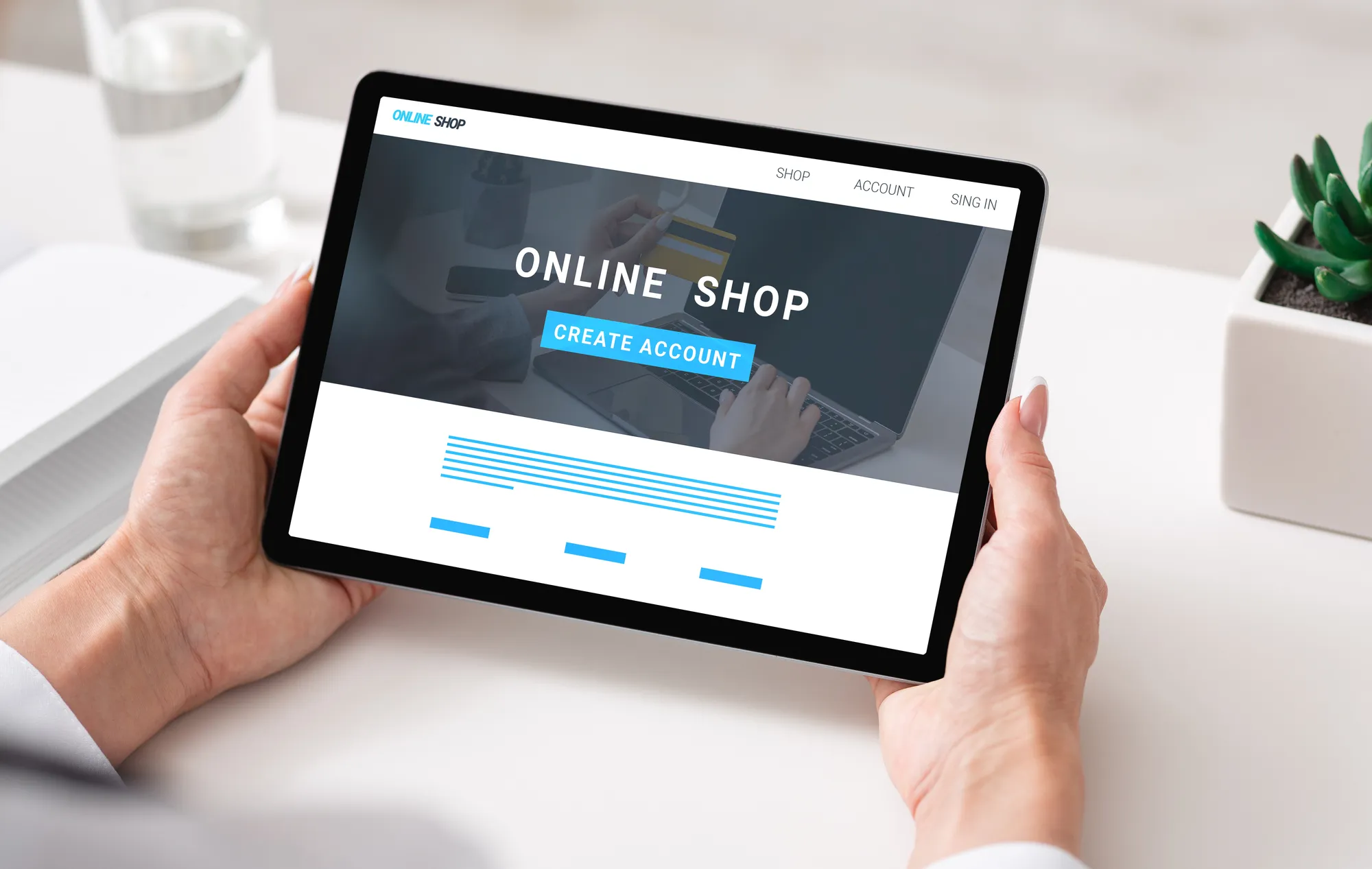 A person holding a tablet with a website for an online shop.