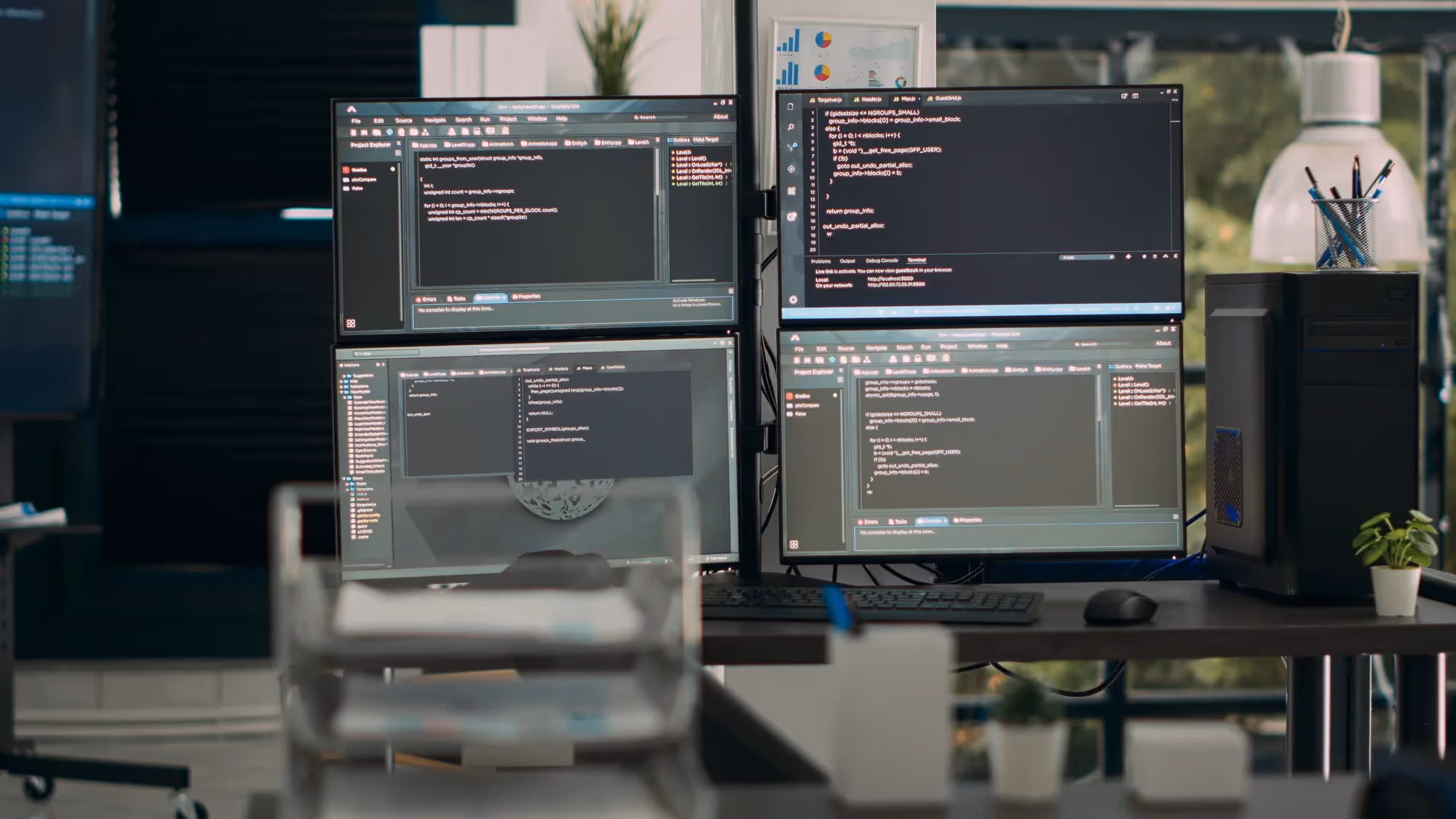 A computer monitor with a blue background and a black keyboard.
