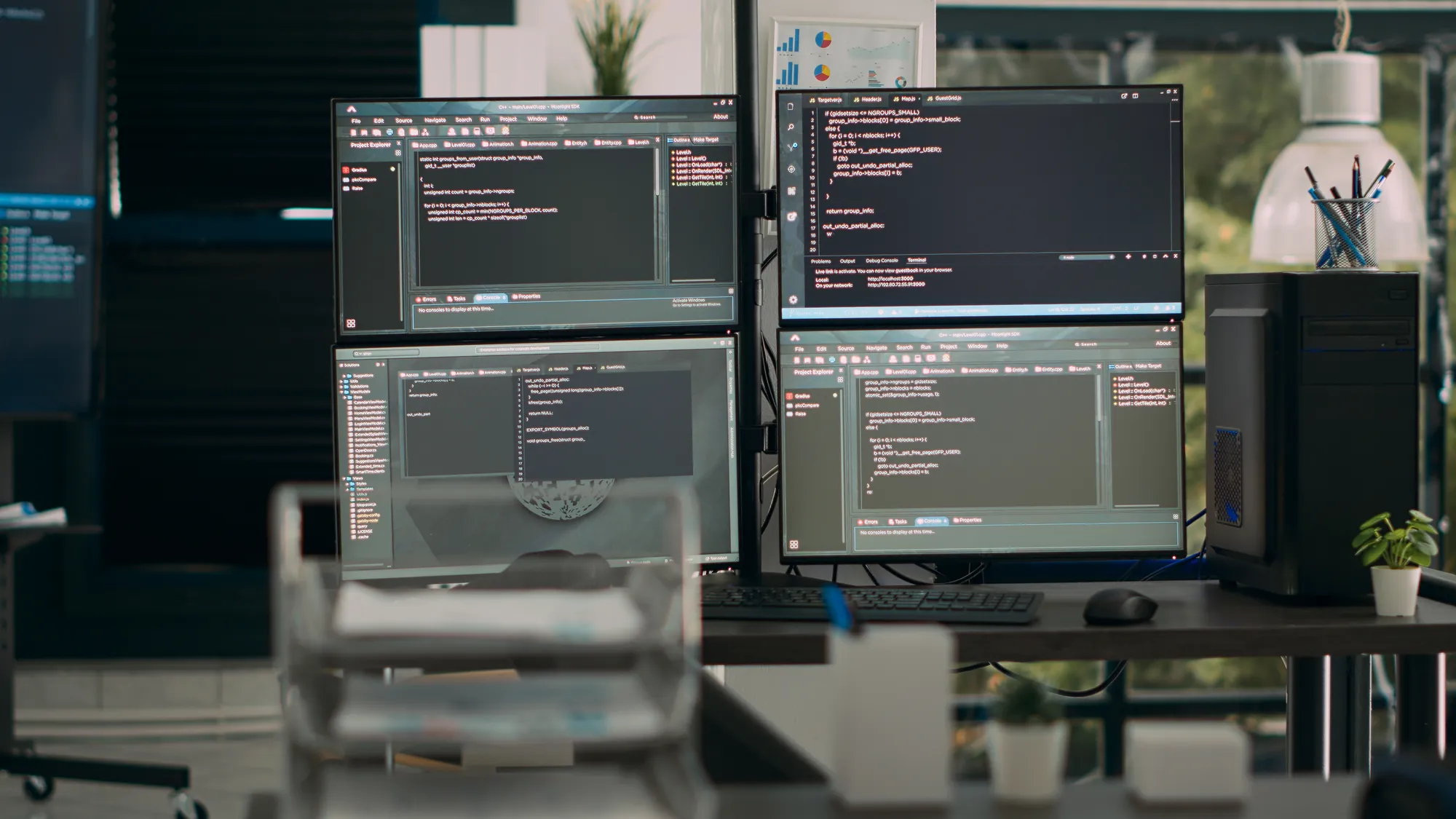 A computer monitor with a blue background and a black keyboard.