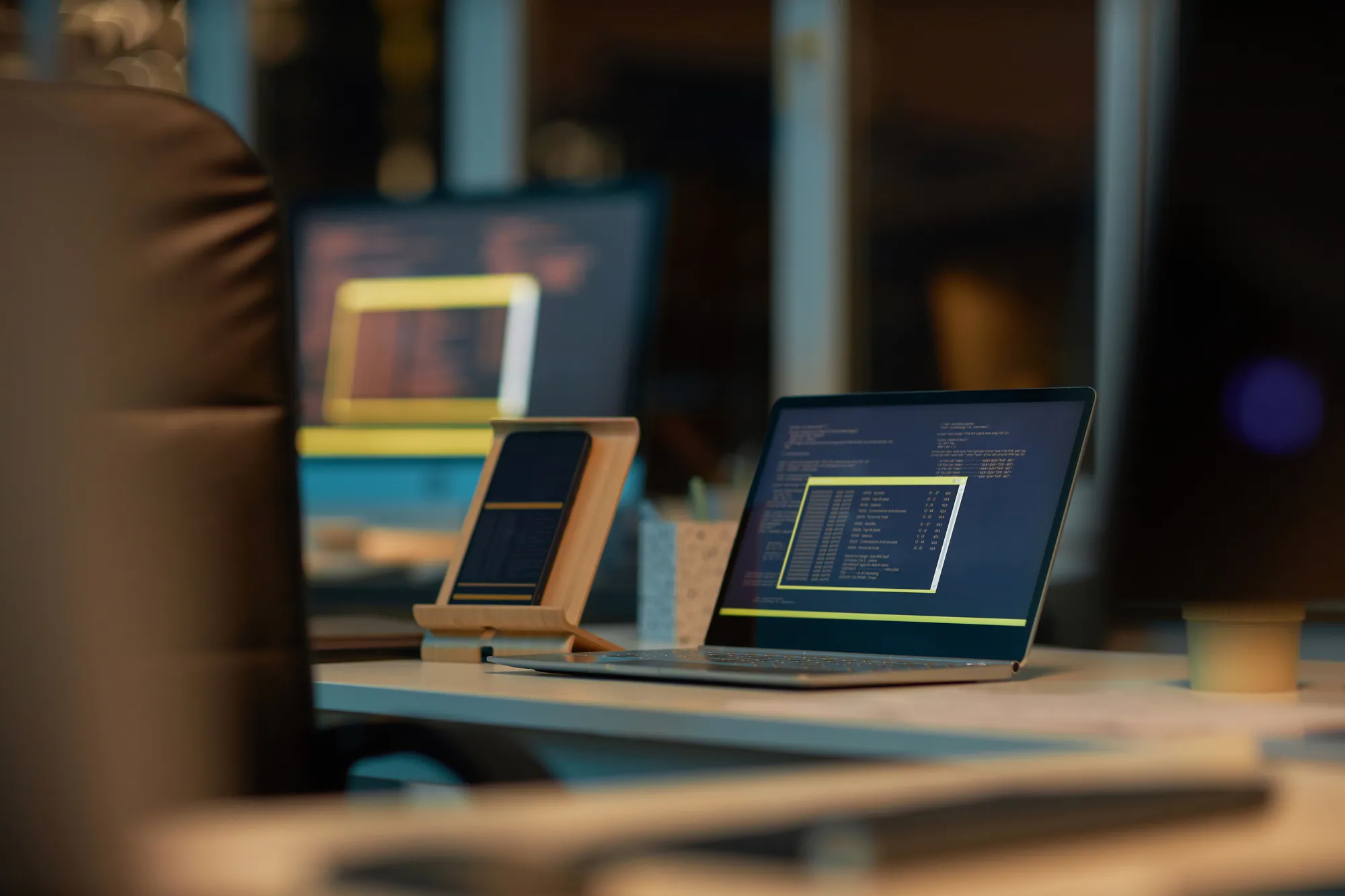 A laptop computer with a yellow square on the screen.