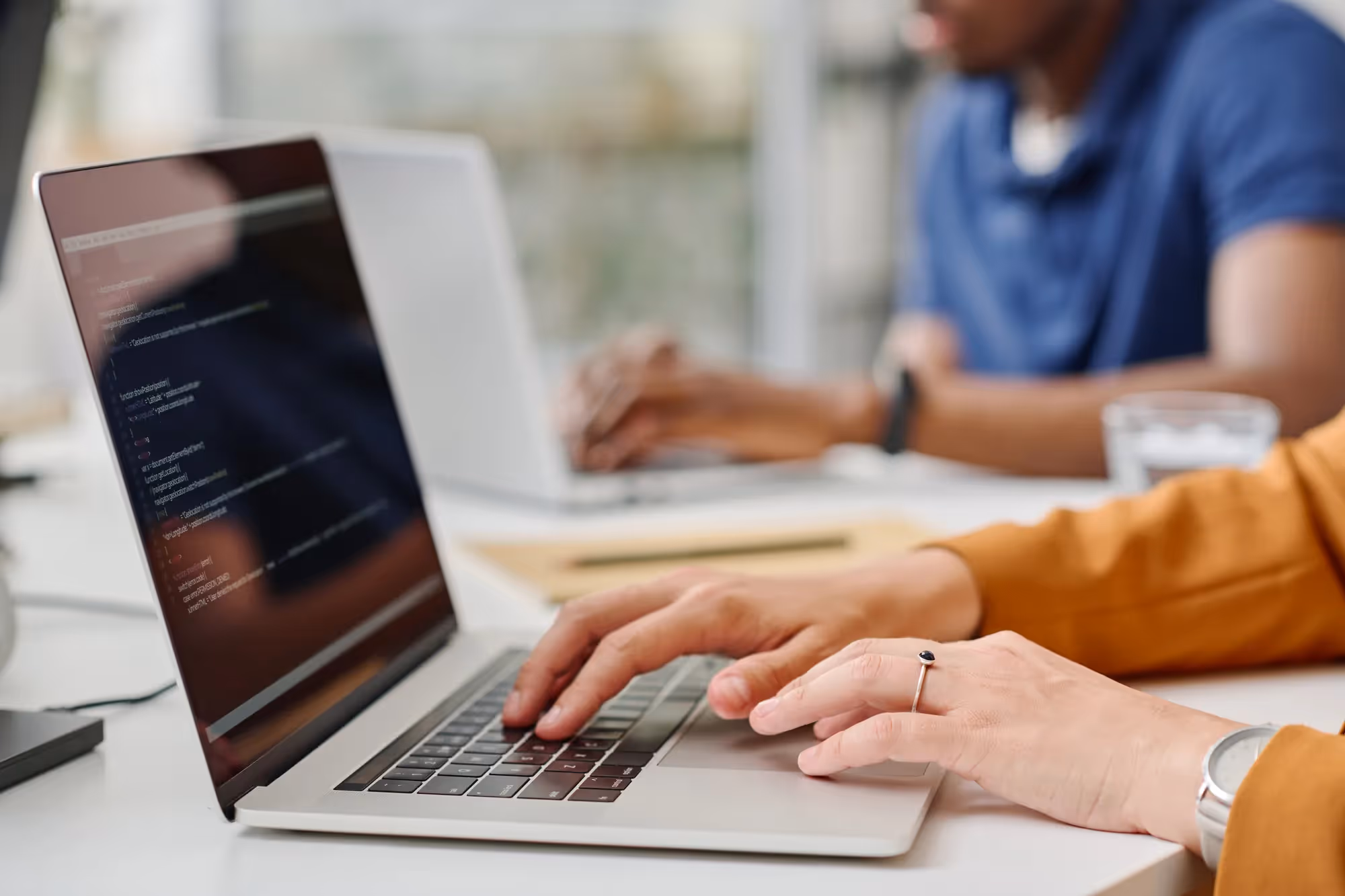 A person is typing on a laptop.
