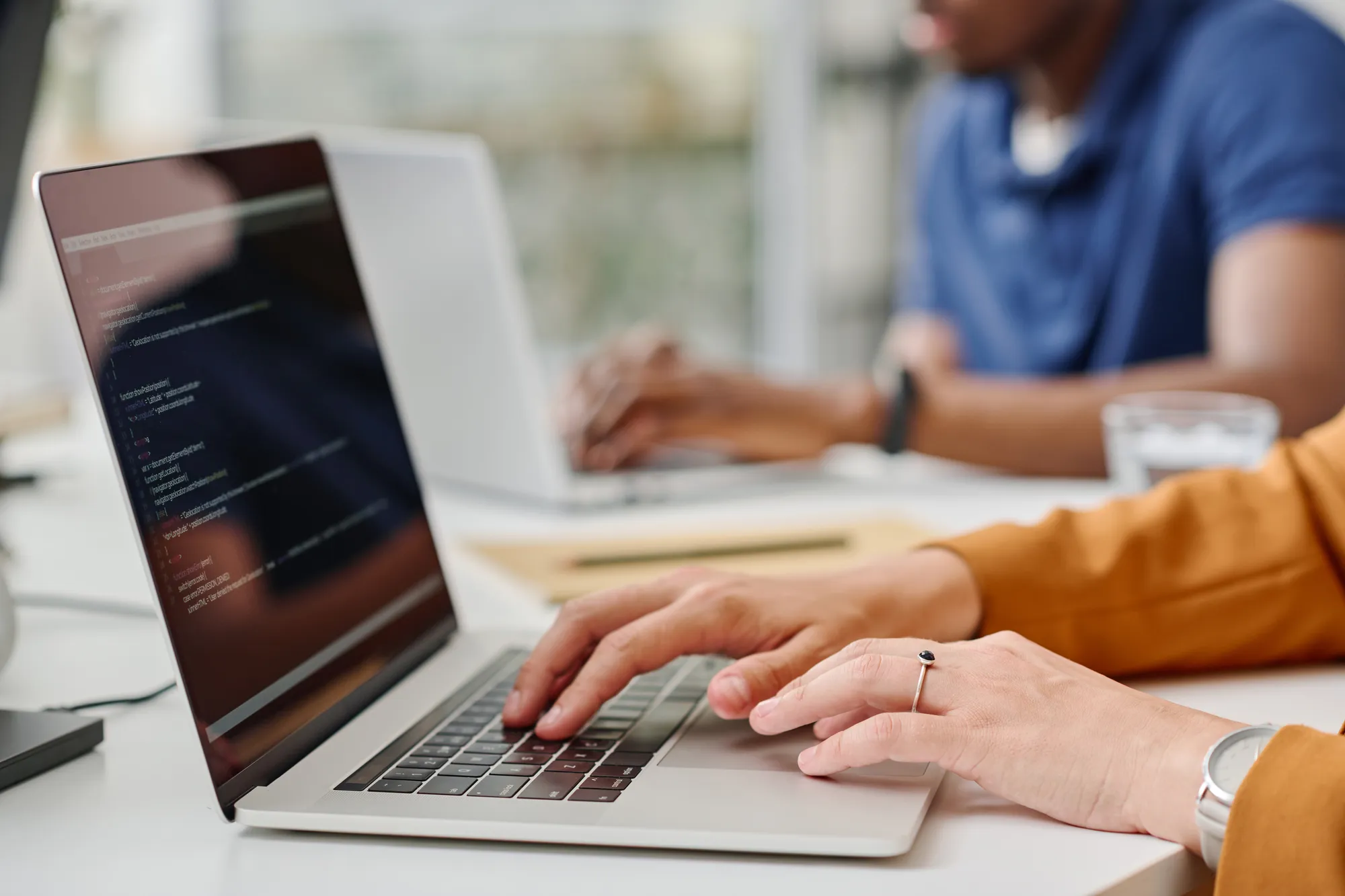 A person is typing on a laptop.
