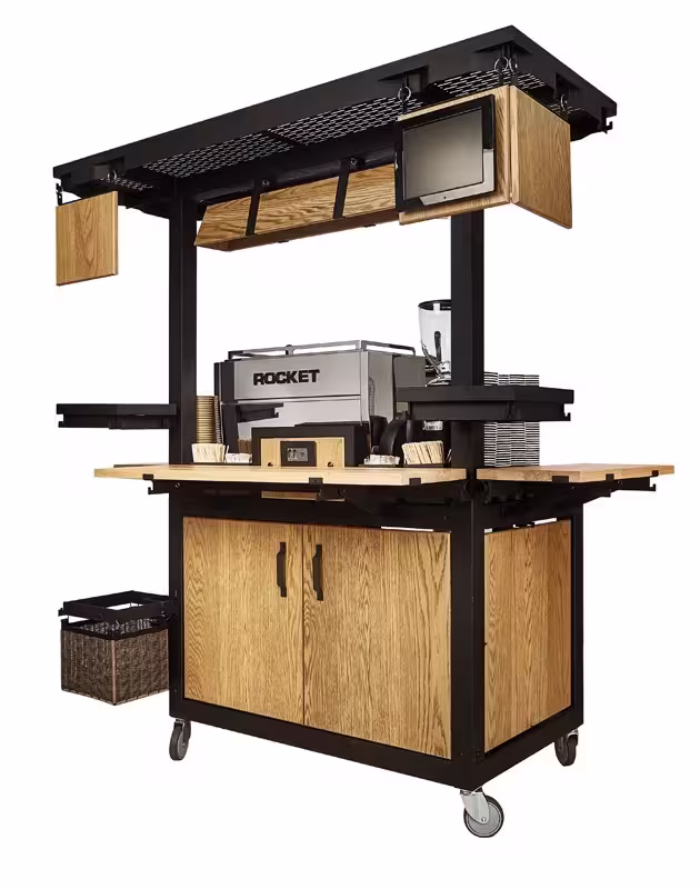 Mobile coffee cart with Rocket espresso machine, wooden panels, shelves, and wheels.