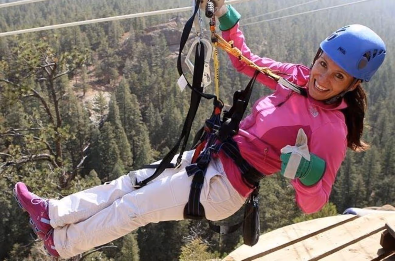 Soar above Colorado's stunning landscapes on a family-friendly zipline course at Seven Falls, featuring five ziplines, two suspension bridges, and a 180-foot rappel.