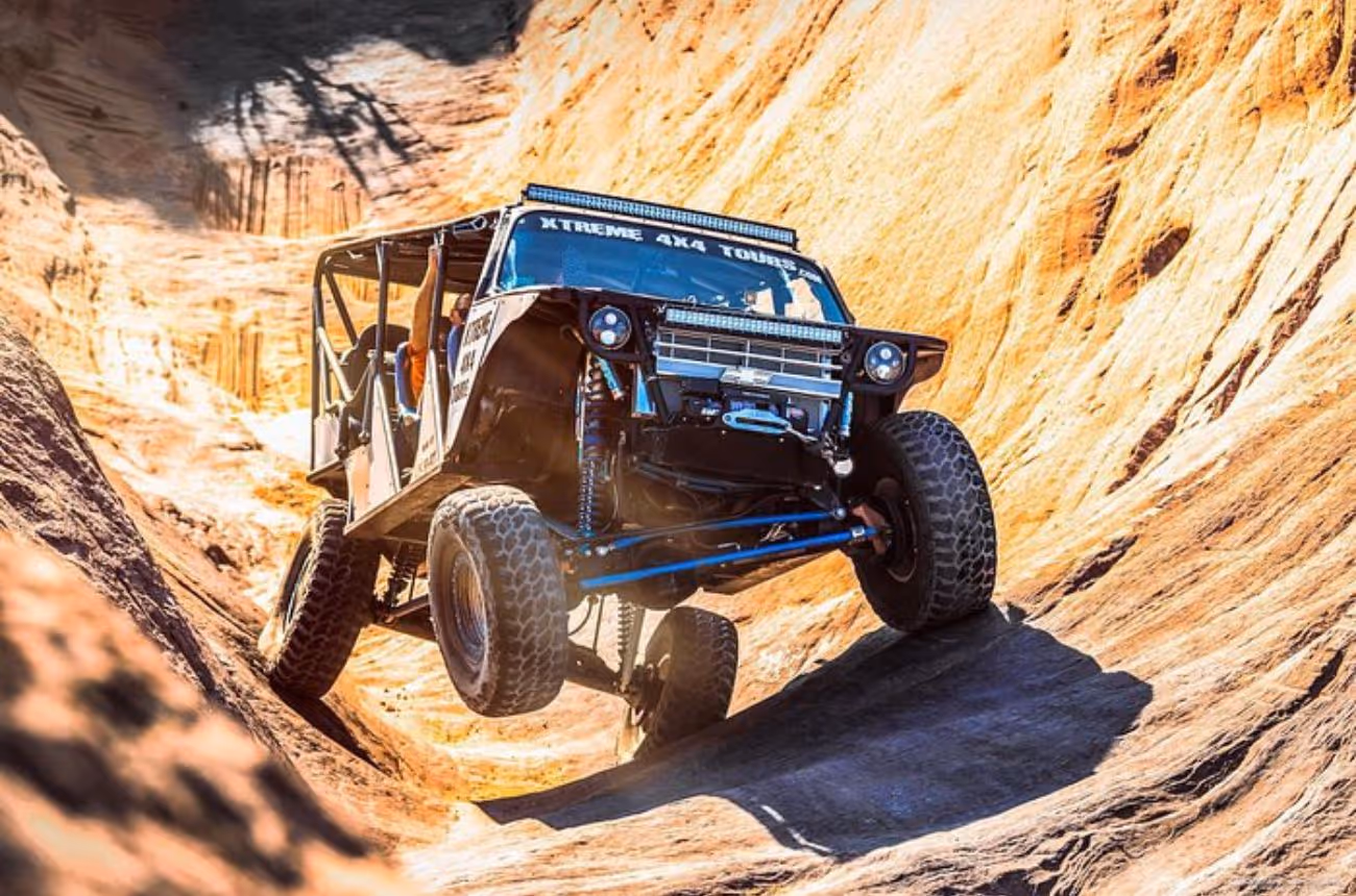 Embark on Moab's most extreme 3-hour adventure, navigating the challenging Hell's Revenge Trail in a custom-built ATV equipped with a roll cage, five-point harnesses, and bucket seats, ensuring both safety and exhilaration.
