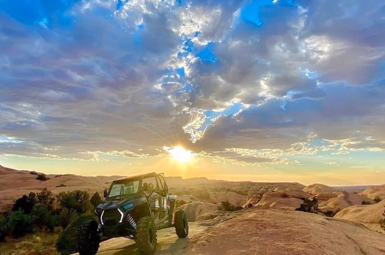 Embark on a thrilling 3.5-hour self-driven UTV adventure through Moab's renowned Fins N Things and Hell's Revenge trails, navigating steep inclines, rocky descents, and the iconic Slickrock terrain under expert guidance.