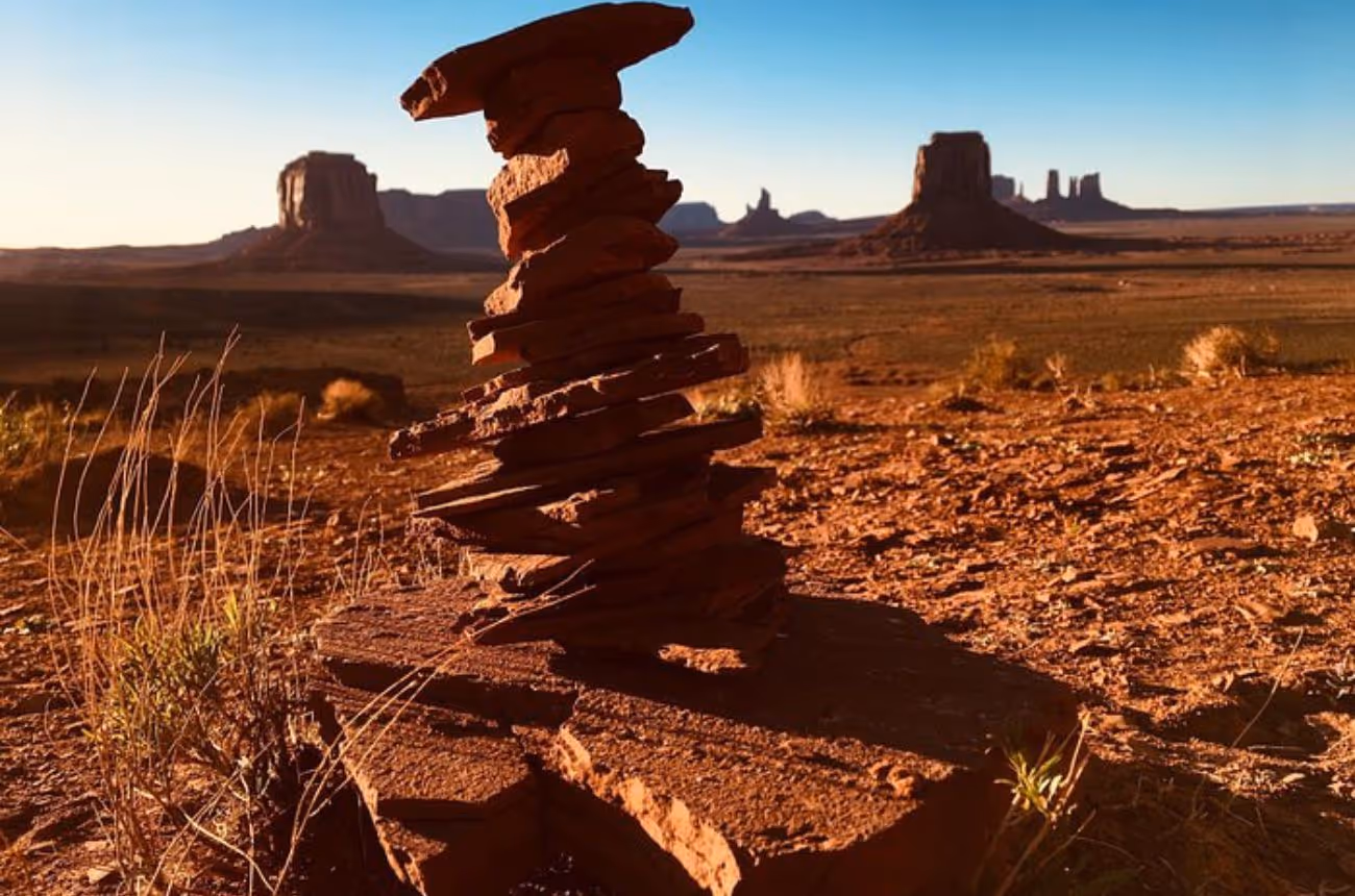 Witness Monument Valley's iconic red sandstone formations bathed in the golden hues of sunset during this 3-hour guided tour, which includes exclusive access to restricted areas and immersive Navajo cultural experiences.