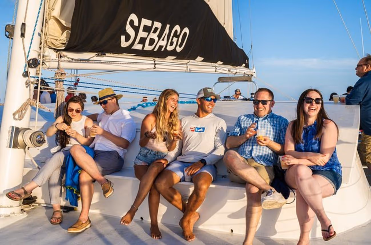 Experience a captivating Key West sunset aboard a spacious catamaran, complemented by live music, a selection of beverages, and delectable hors d'oeuvres.