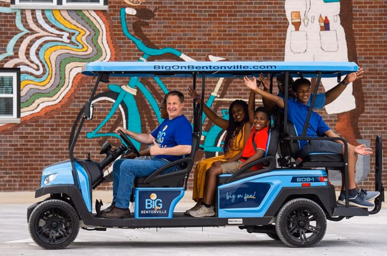 Discover Bentonville's vibrant culture and history on a guided golf cart tour, exploring murals, museums, and hidden gems with a local expert.