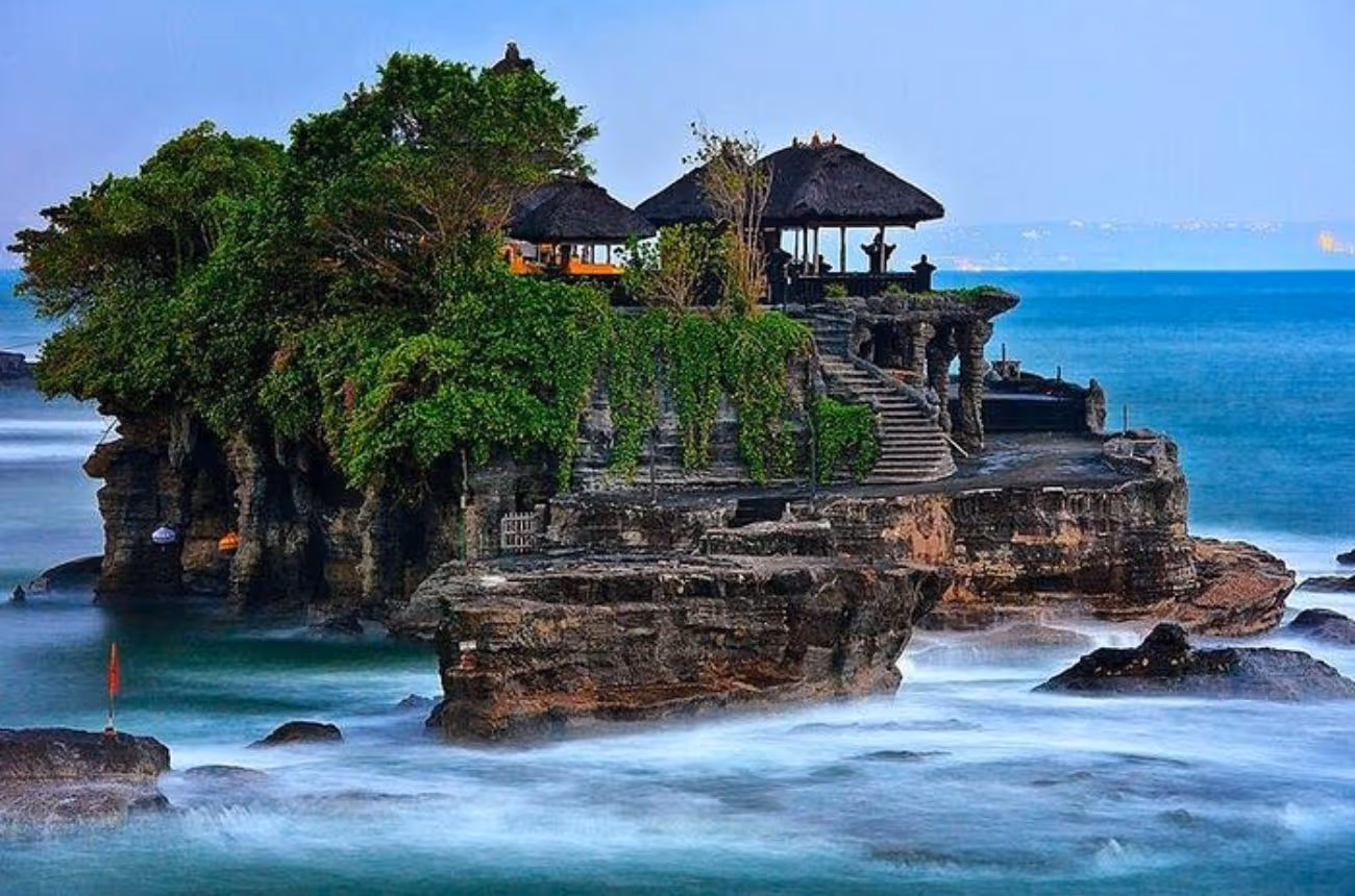 Explore Bali’s cultural and natural wonders with a private full-day journey including coastal sea temples, UNESCO rice terraces, a serene lakeside shrine, and panoramic highland views.