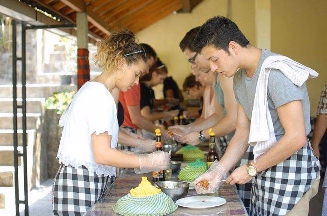 Spend a relaxed half-day learning authentic Balinese cooking techniques—from market shopping to hands-on preparation—with private transport and local guidance.