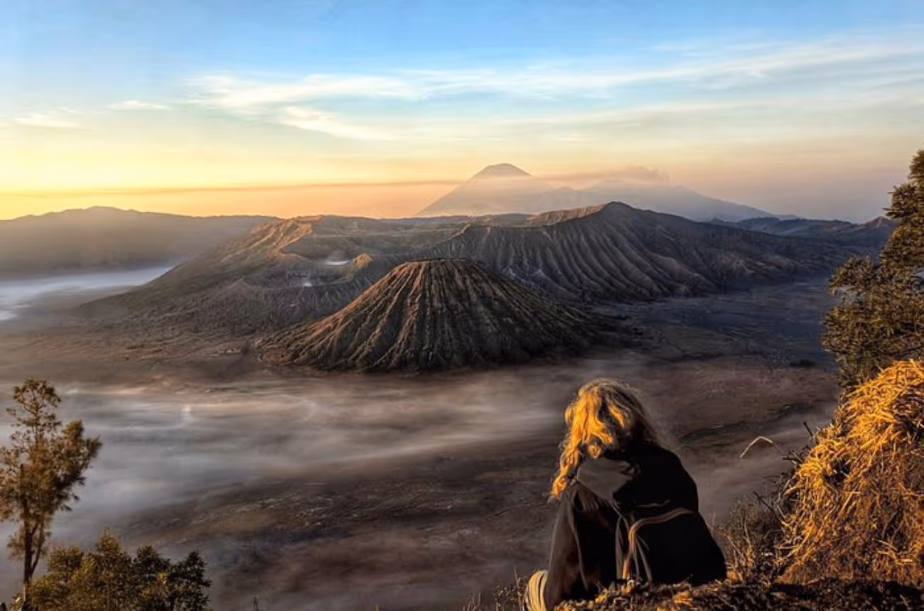 Embark on an unforgettable nighttime 4WD adventure to witness a breathtaking sunrise over Mount Bromo's smoking crater, set amidst the vast “Sea of Sand.”