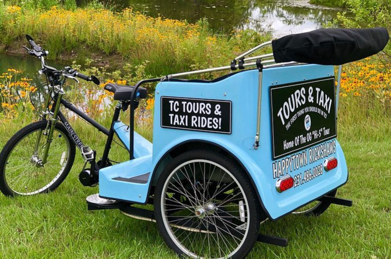 Explore Traverse City's vibrant neighborhoods and waterfront views on a personalized private pedicab tour, featuring local insights and history.