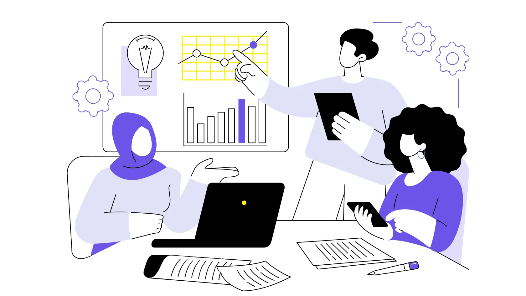 Three people are discussing graphs and data at a table using laptops and tablets.