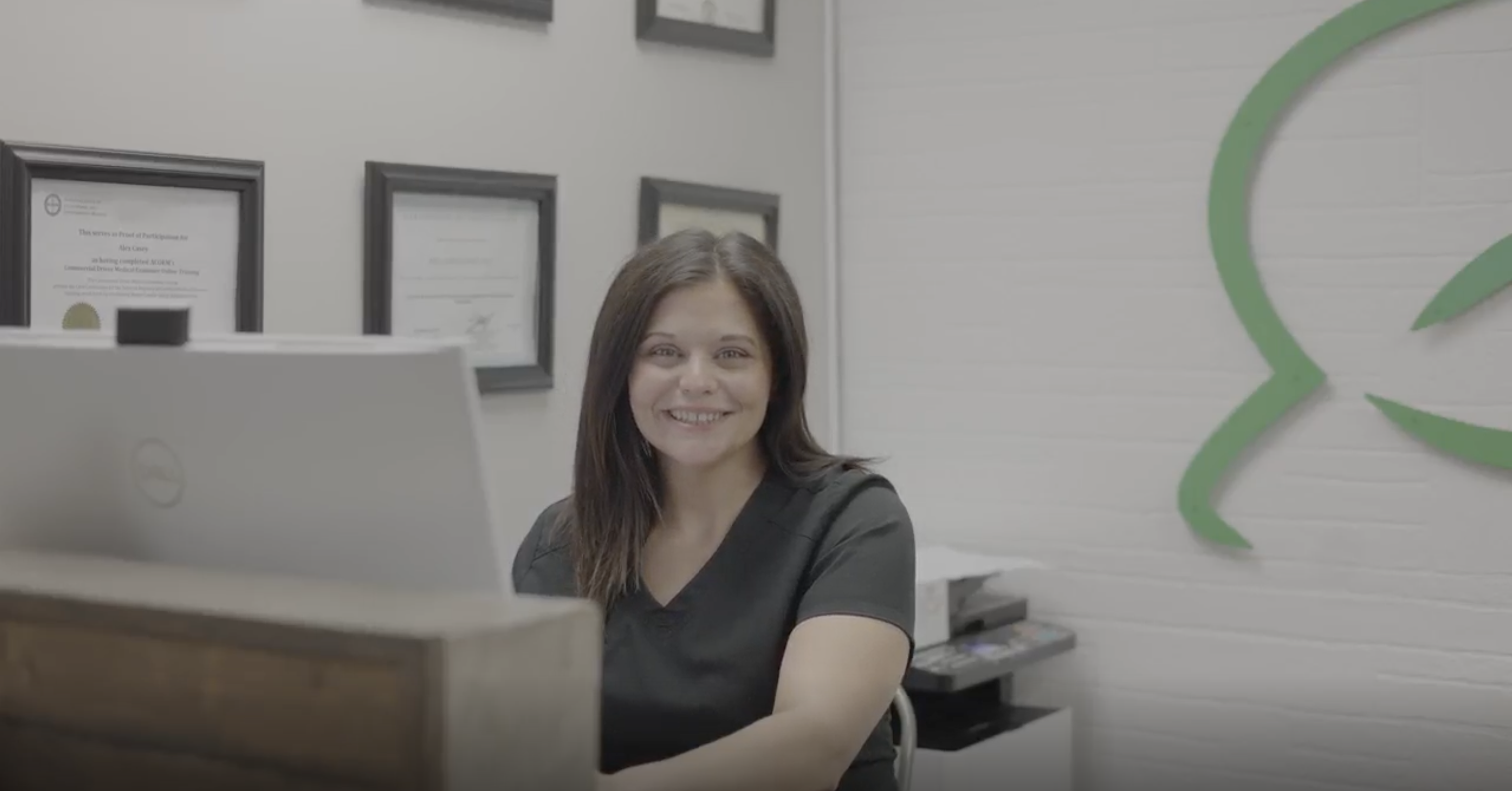 Close-up of a healthcare professional examining and palpating a patient's knee joint, indicating a medical evaluation or treatment.