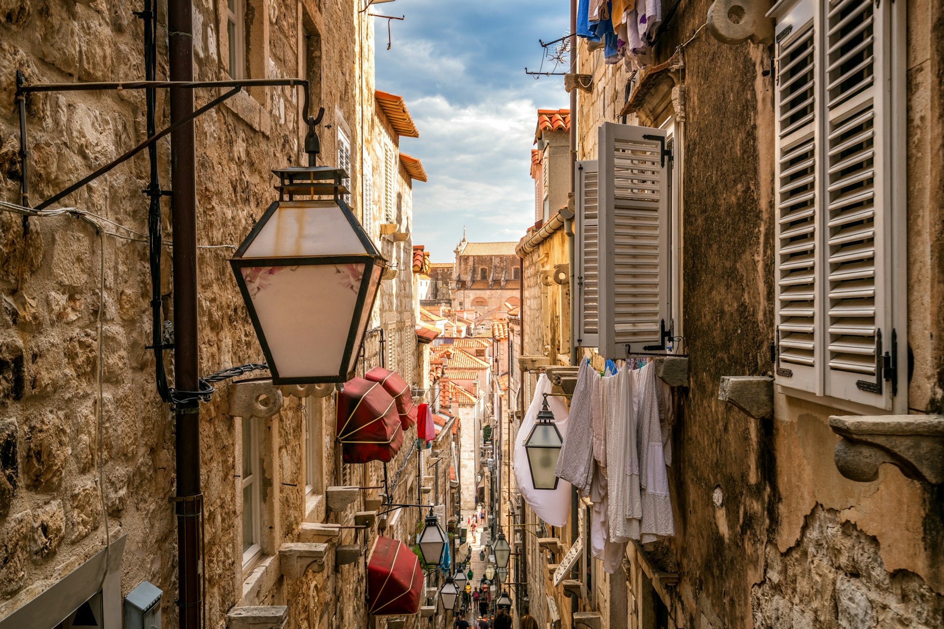 A narrow alleyway in Florence, featuring several buildings and a few windows along its sides.