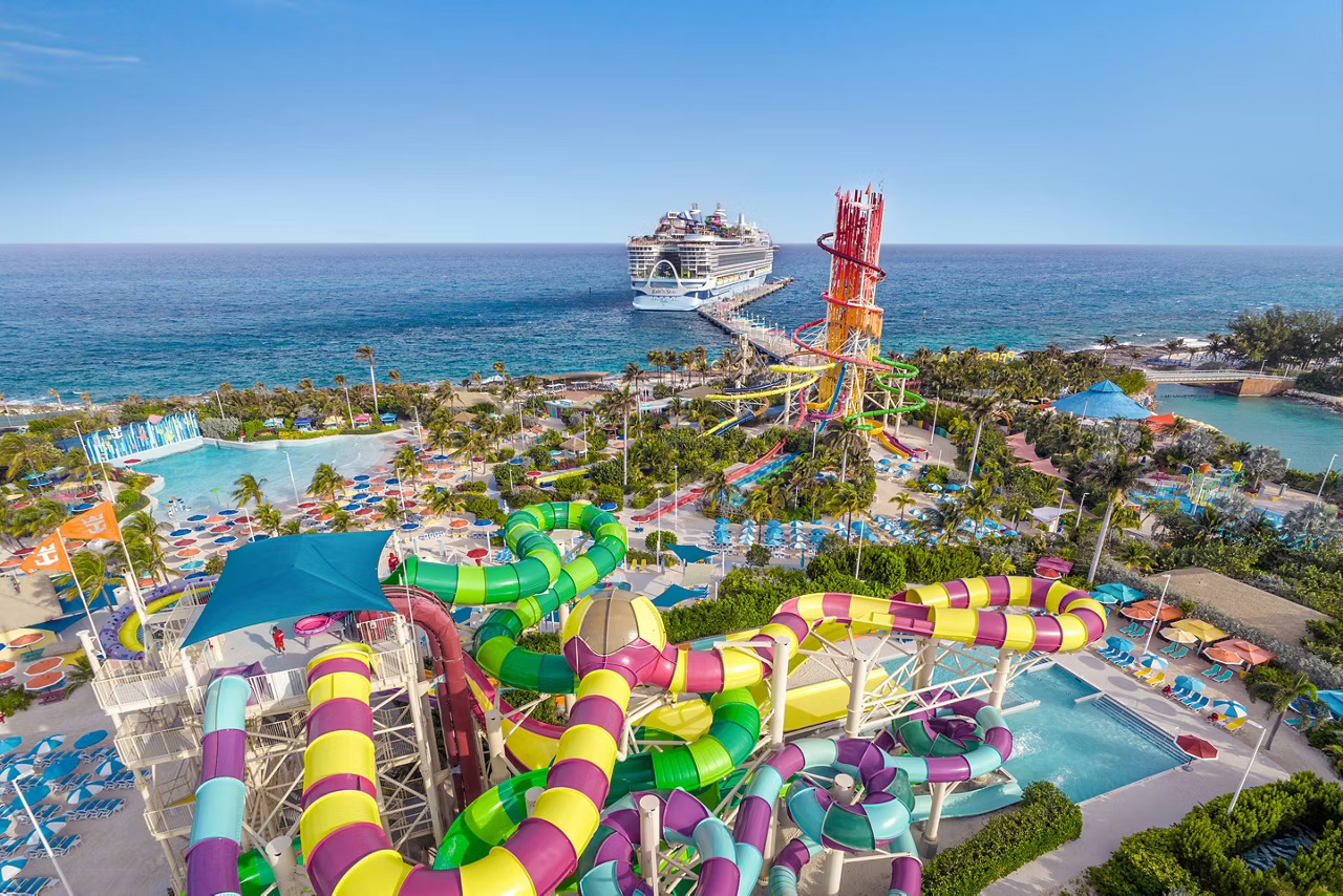 A vibrant water park featuring a Legend of the Seas and a thrilling water slide at Perfect Day at Cococay.