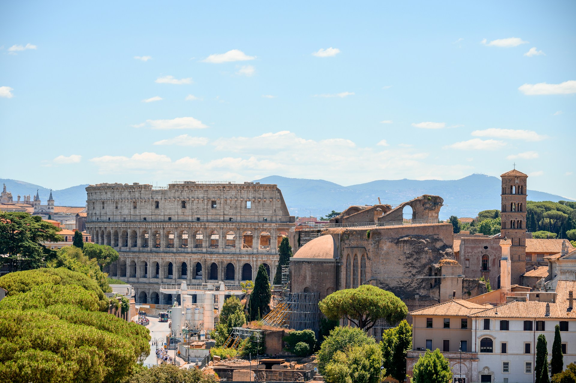 1. The Colosseum in Rome, Italy, showcasing its ancient architecture and iconic arches against a clear blue sky.