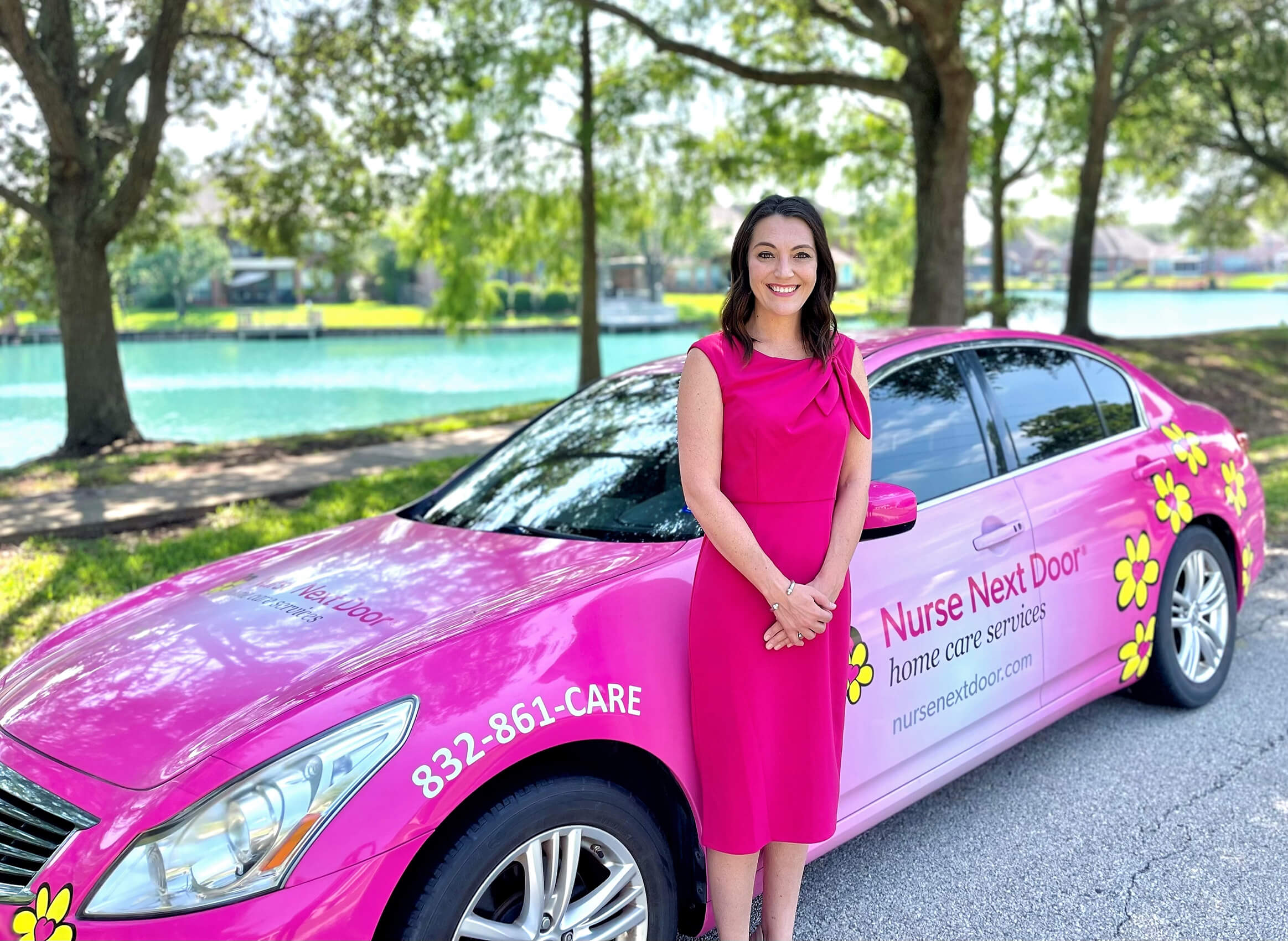 Nurse Next Door Home Care franchisee standing in front of her car.