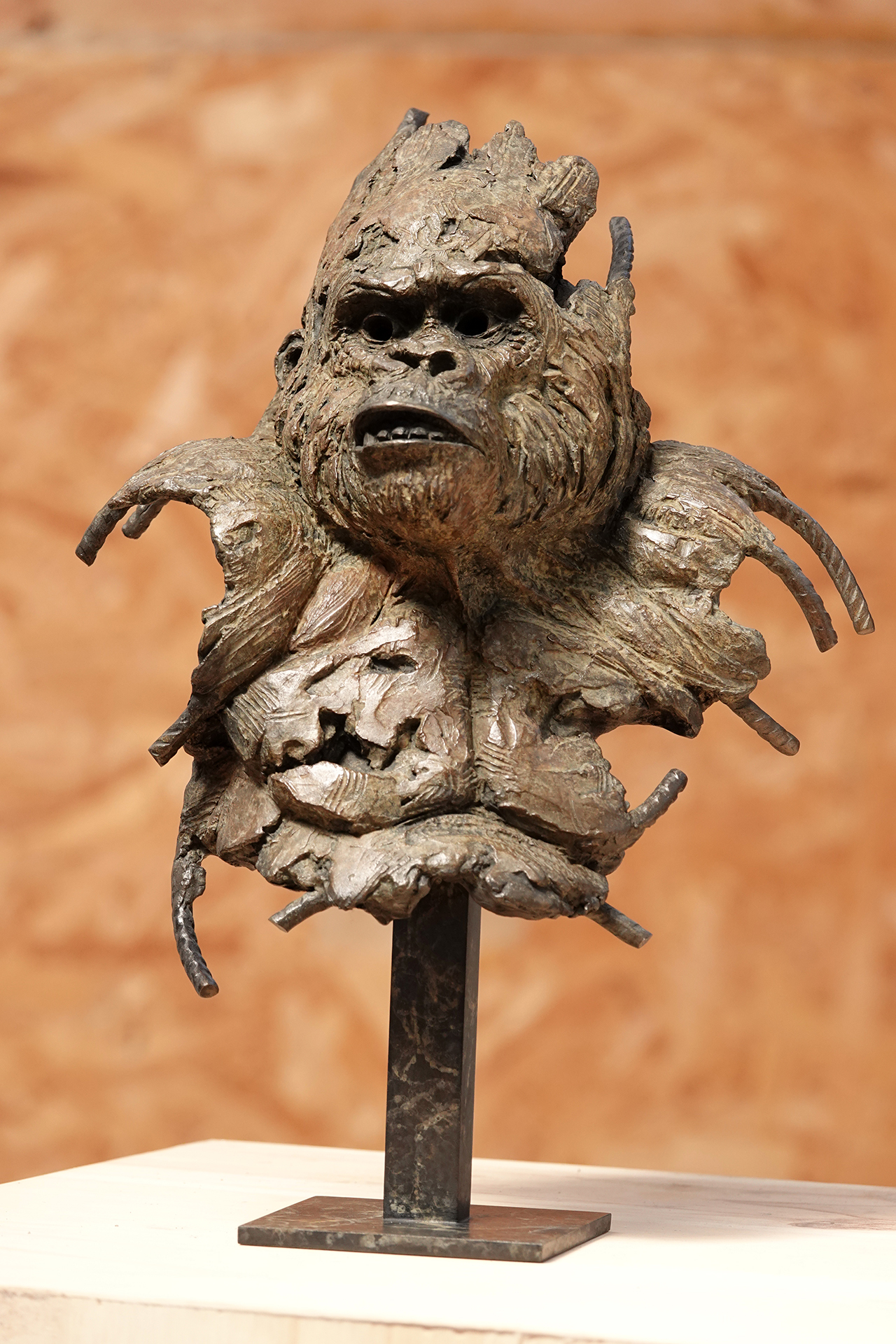 Bronze animal sculpture of a gorilla head on a metal stand, by wildlife sculptor Pierre-Jean Chabert.