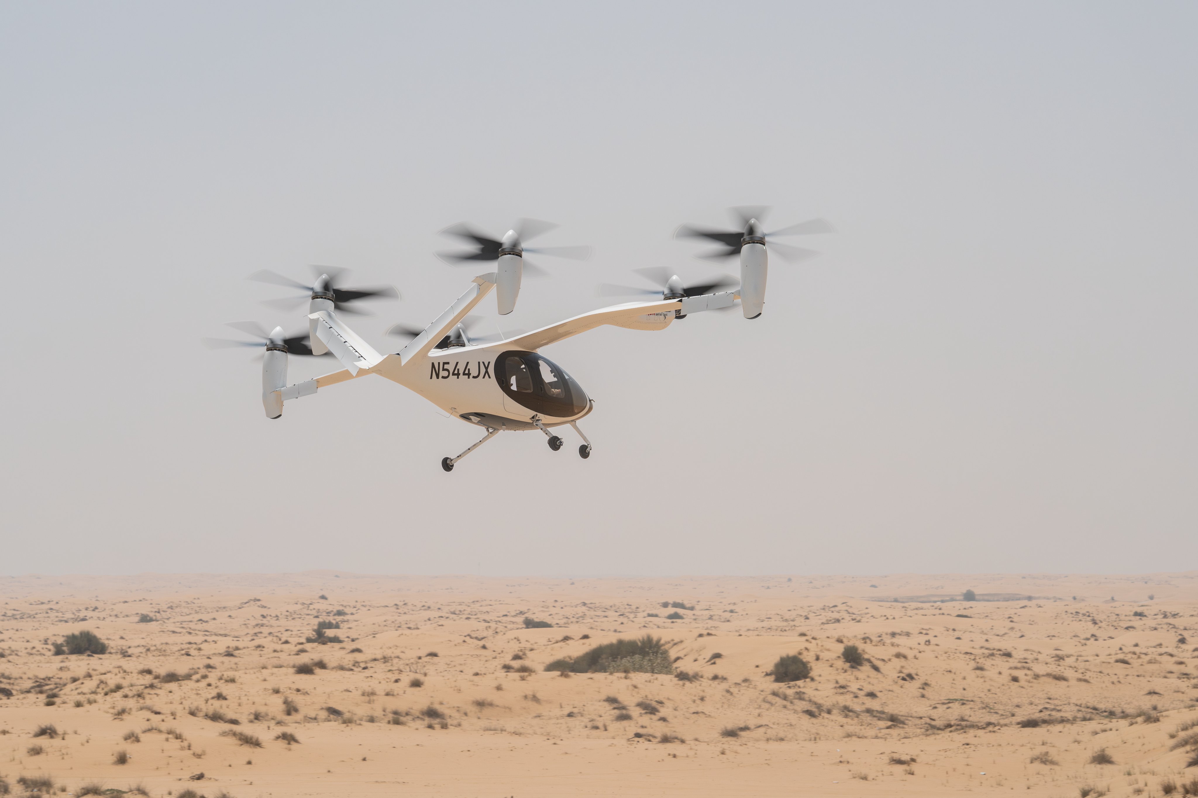 Joby Aviation eVTOL air taxi flying over Dubai desert during test flight