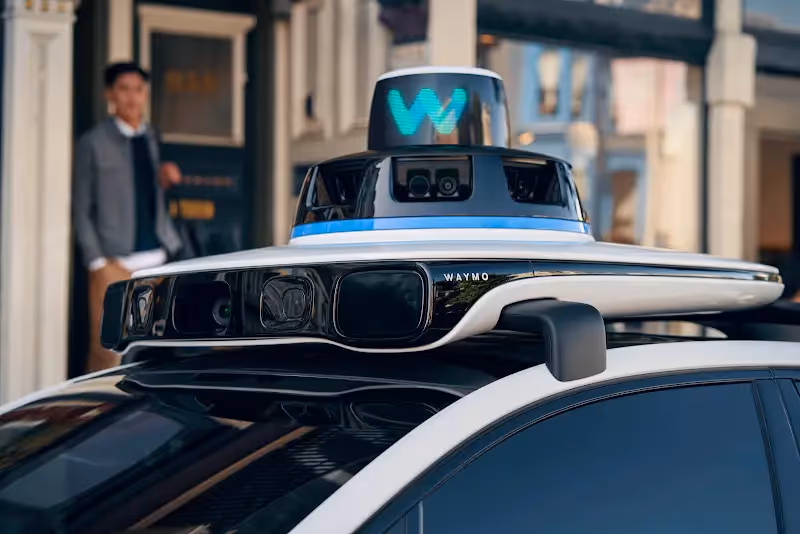 Waymo self-driving vehicle operating on a city street, illustrating advancements in autonomous transportation technology.