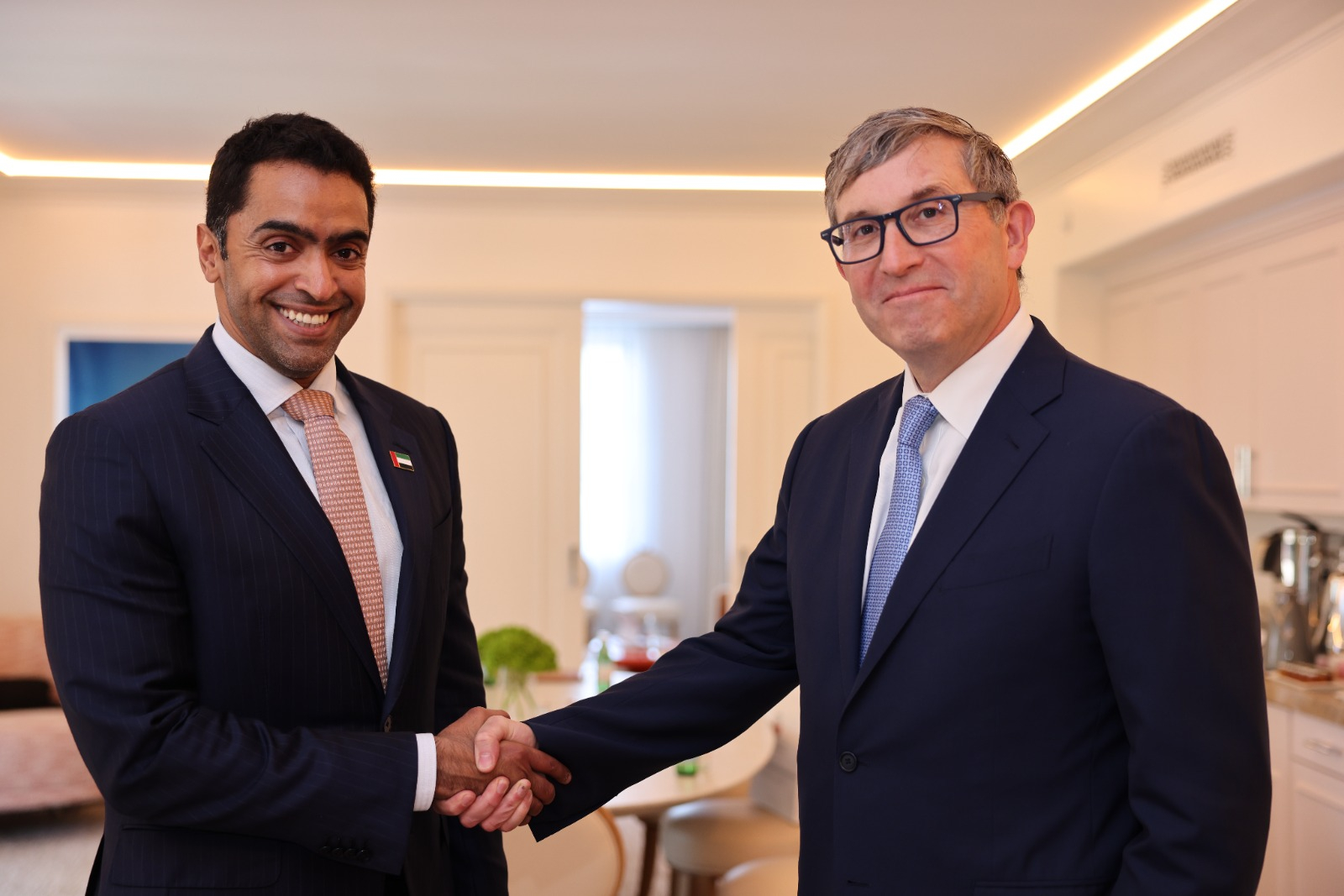 Abu Dhabi Department of Health Chairman Mansoor Al Mansoori and Oura CEO Tom Hale shake hands during a meeting announcing a preventive healthcare partnership.