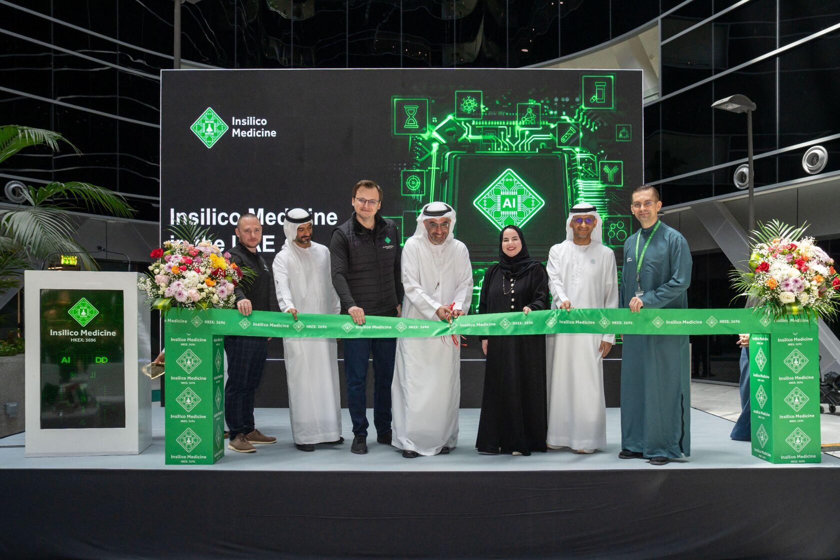 Leaders from Insilico Medicine, ADIO, the Department of Health – Abu Dhabi, ADCAN Pharma, and Masdar City participate in a ribbon-cutting ceremony in Abu Dhabi.