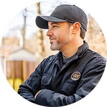 A candid image of an HVAC employee looking to his right