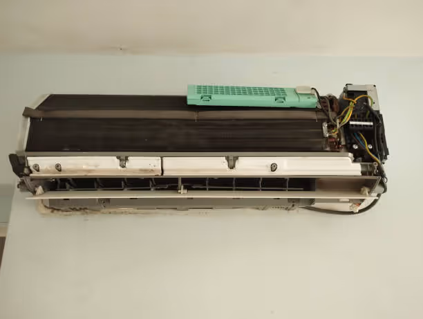 Disassembled air conditioning or heat pump indoor unit component