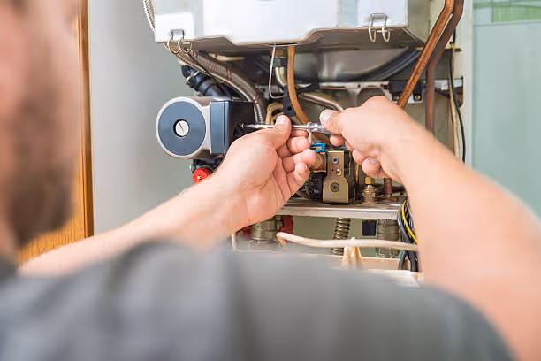 Technician repairing internal components of an electrical or mechanical device