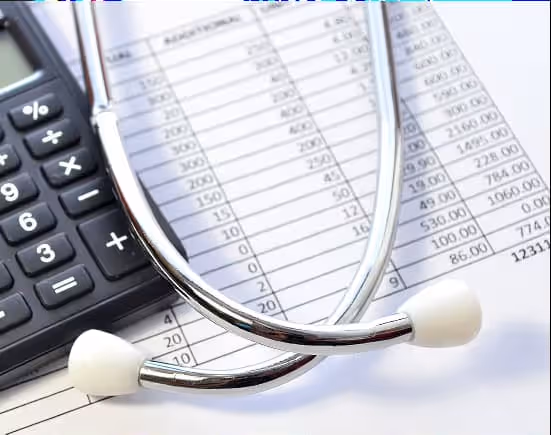 Person working on a computer coding HTML in a modern office environment.