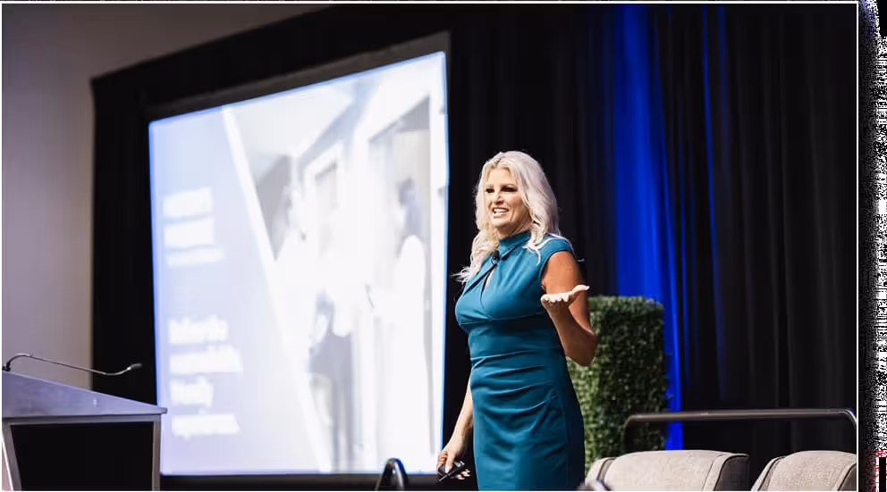Young woman speaking confidently to an audience during a presentation or seminar, showcasing leadership, communication, and public speaking skills.