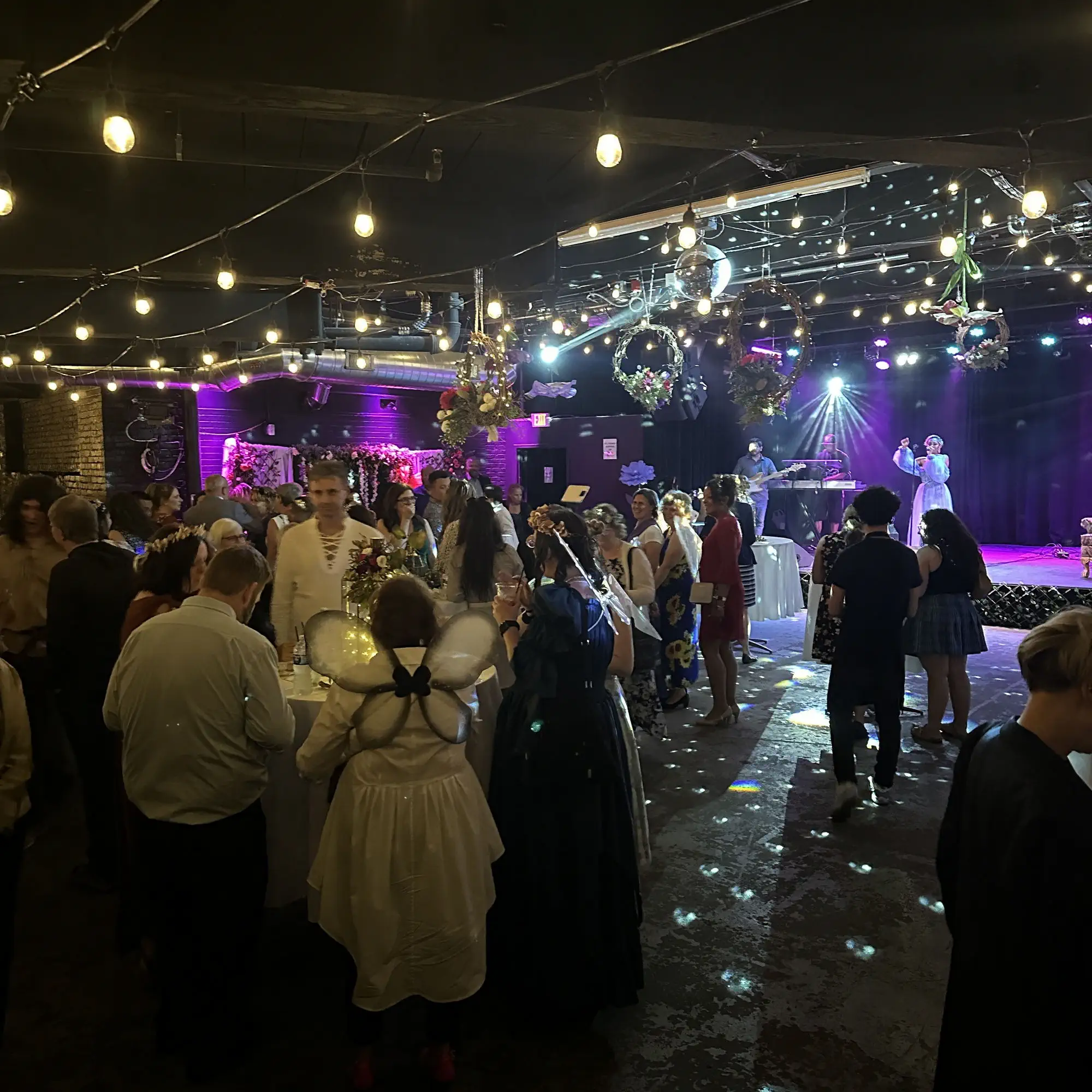 A crowd gathered in front of the stage during a private event at Taffeta Music Hall