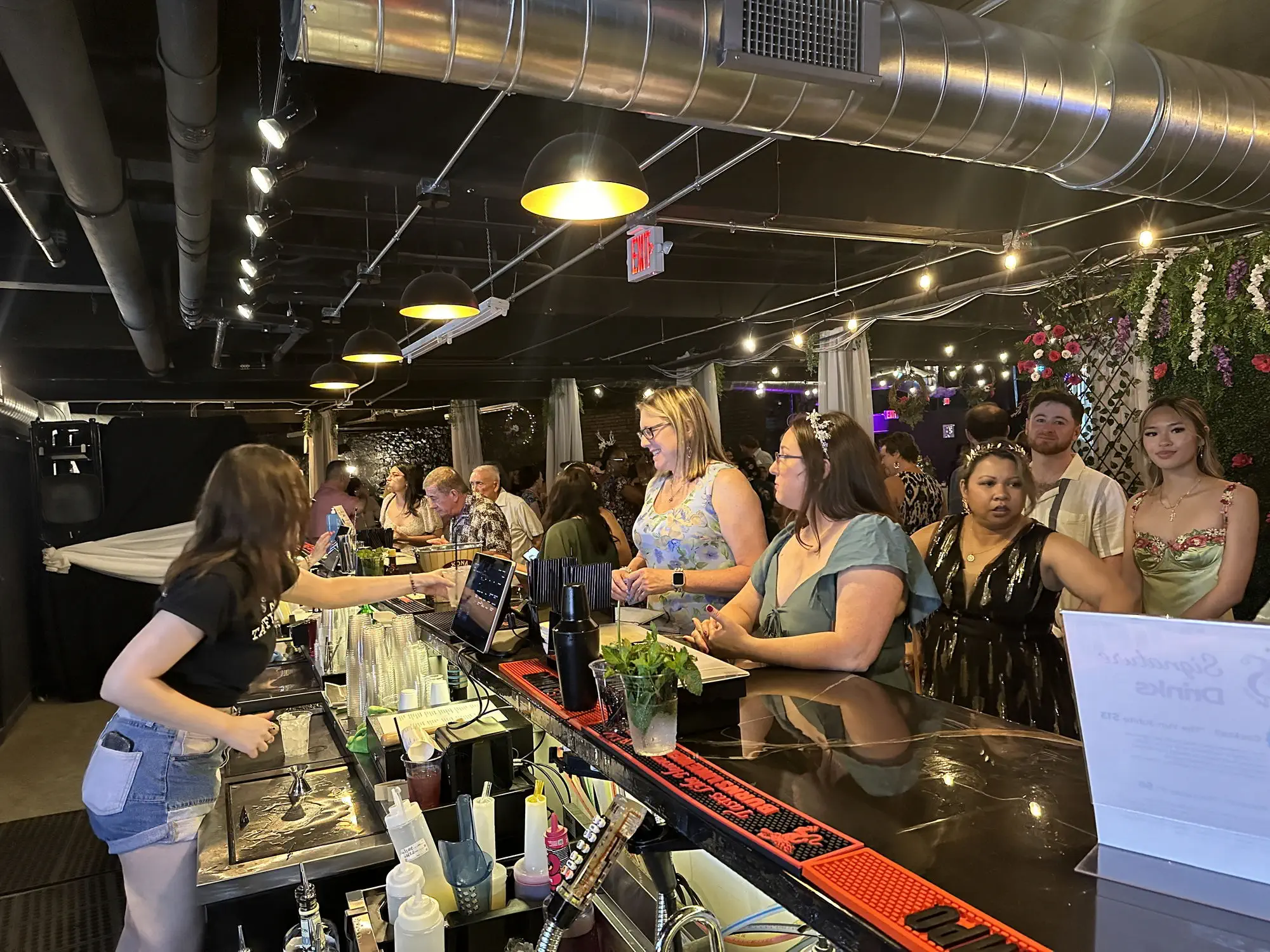 Guests being served at the bar during a private event at Taffeta Music Hall