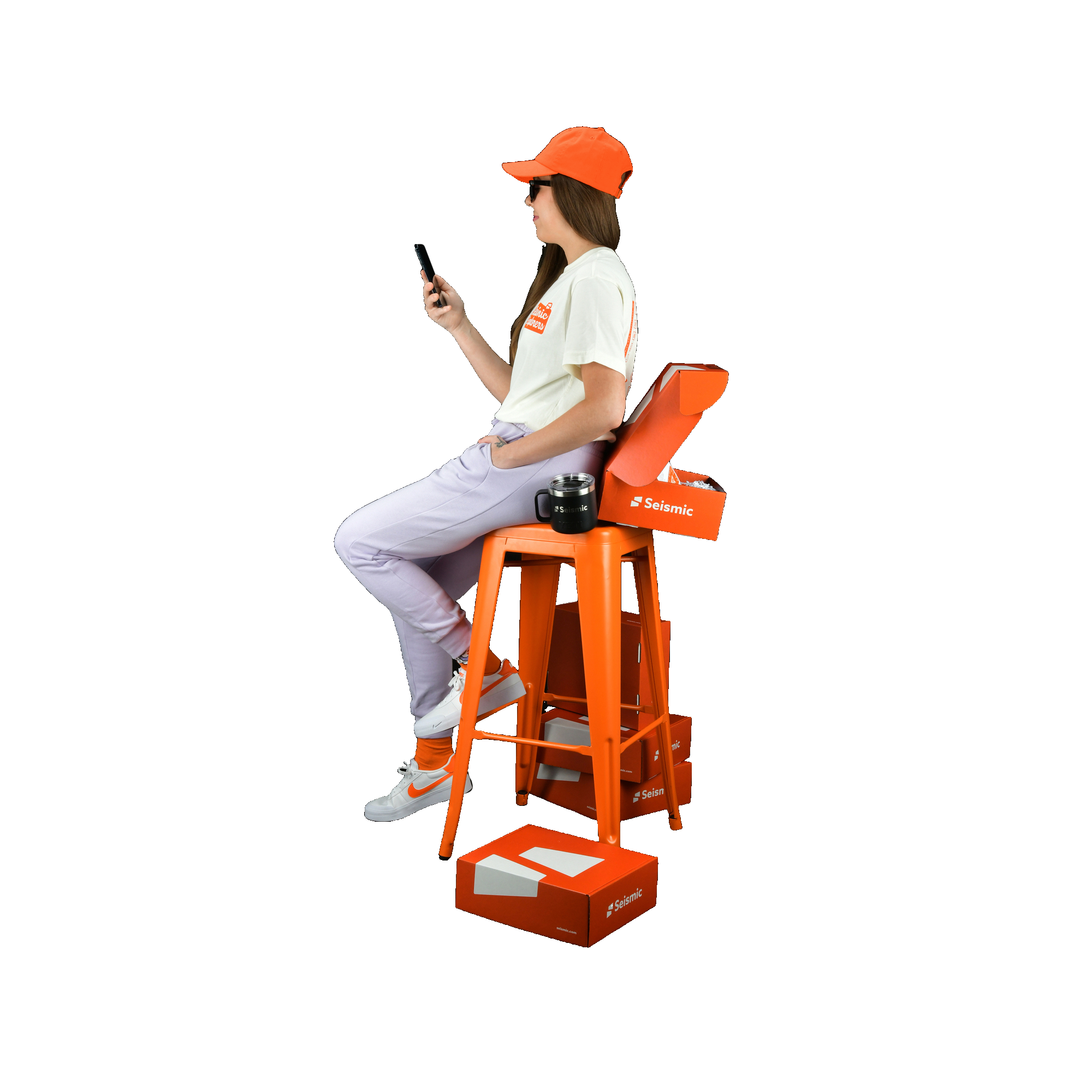 girl using mobile and setting on the chair