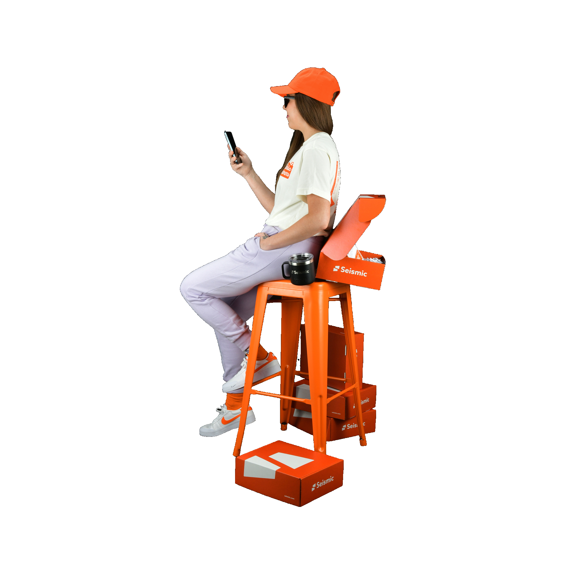 girl using mobile and setting on the chair 