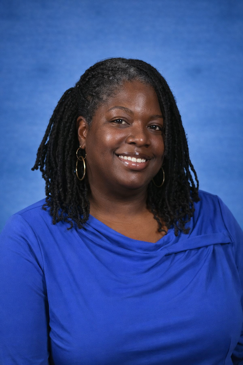 Ms Laguerre smiling in professional staff portrait photo