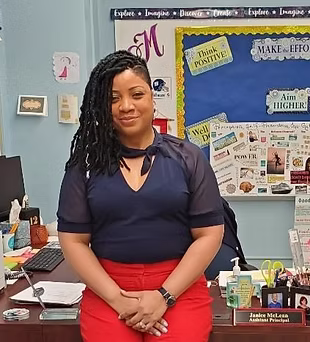 Assistant Principal Janice McLean seated at her office desk