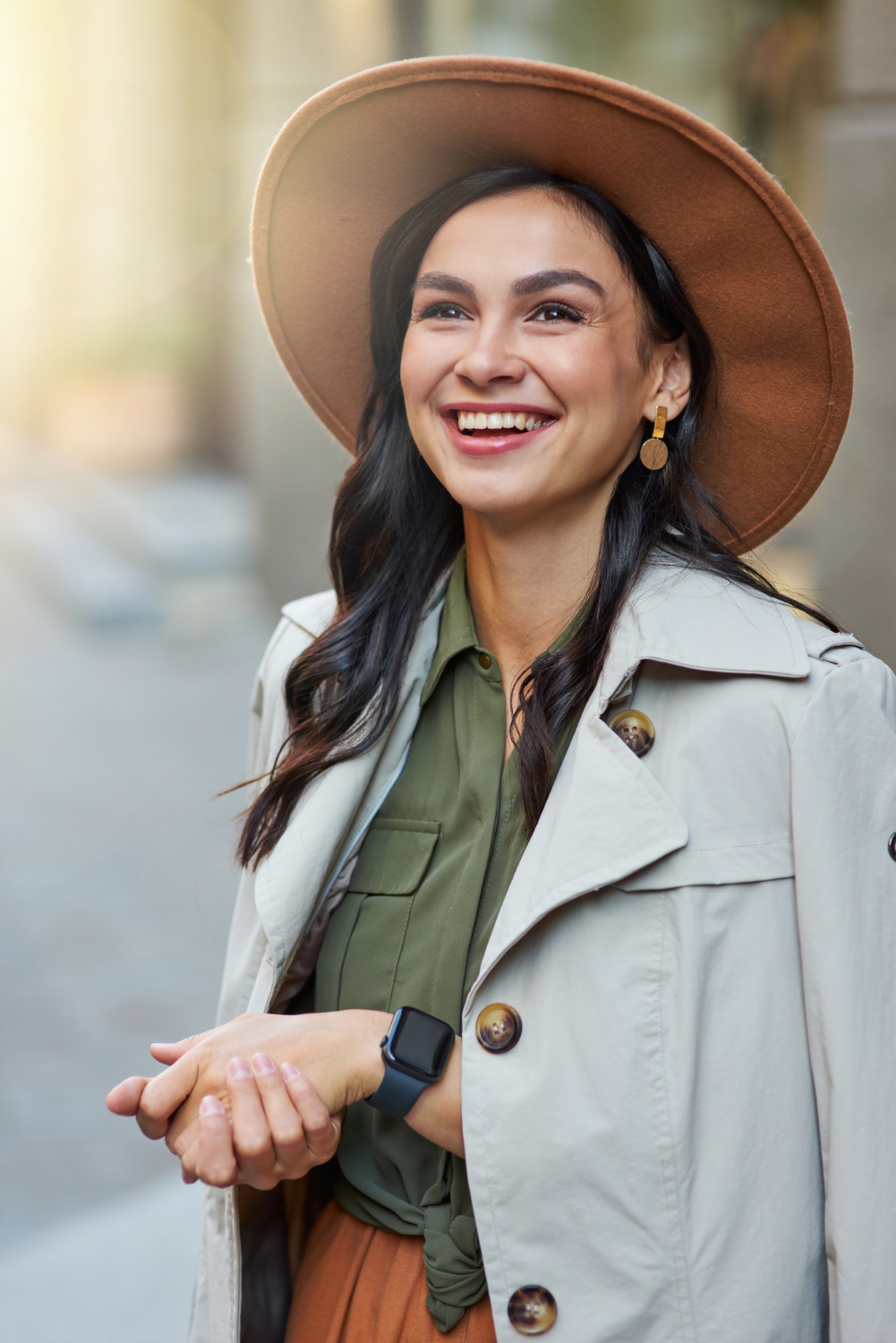 A smiling woman outdoors, used to illustrate the human side of peer support.