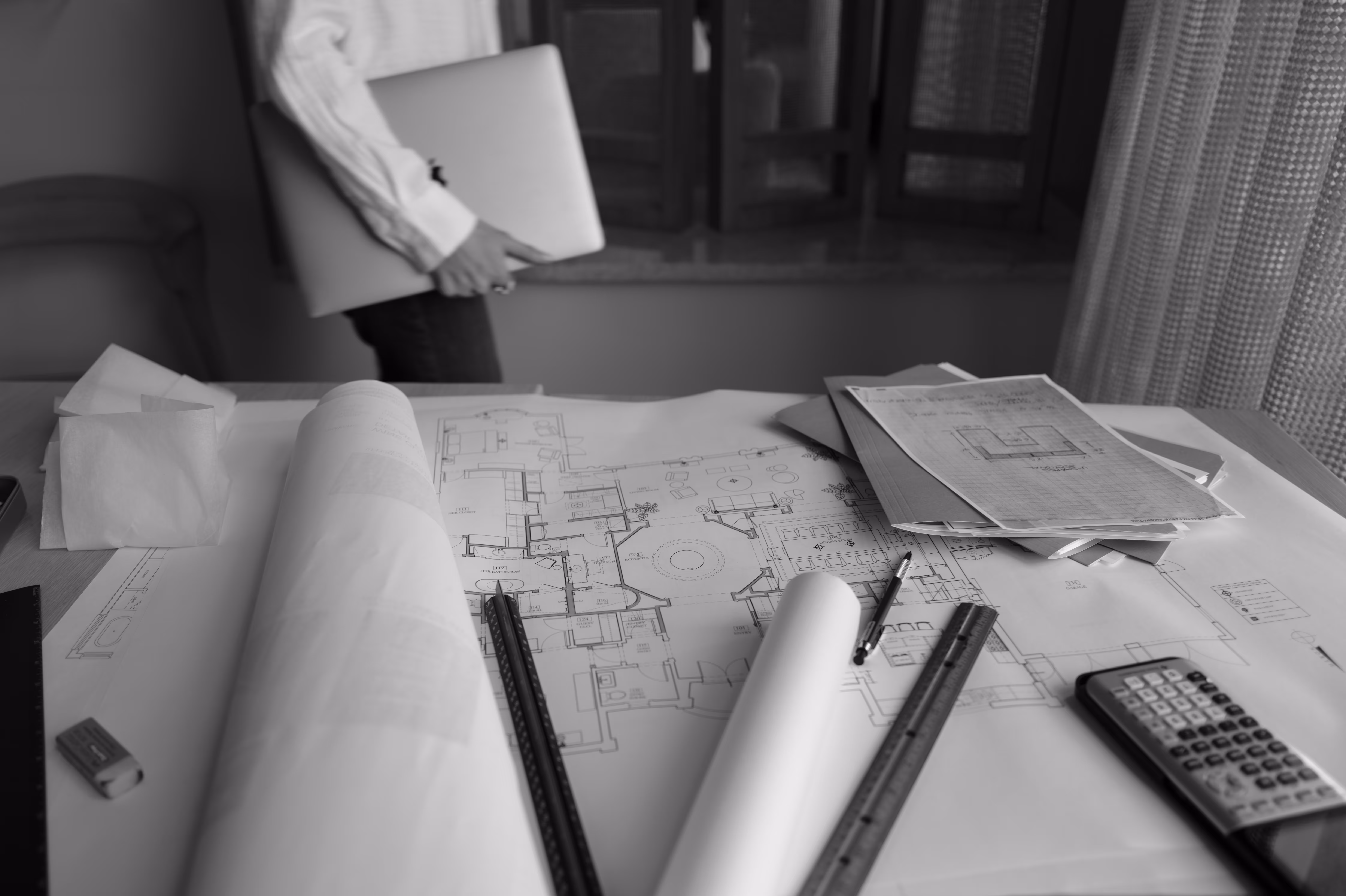 Architectural workspace with blueprints and tools