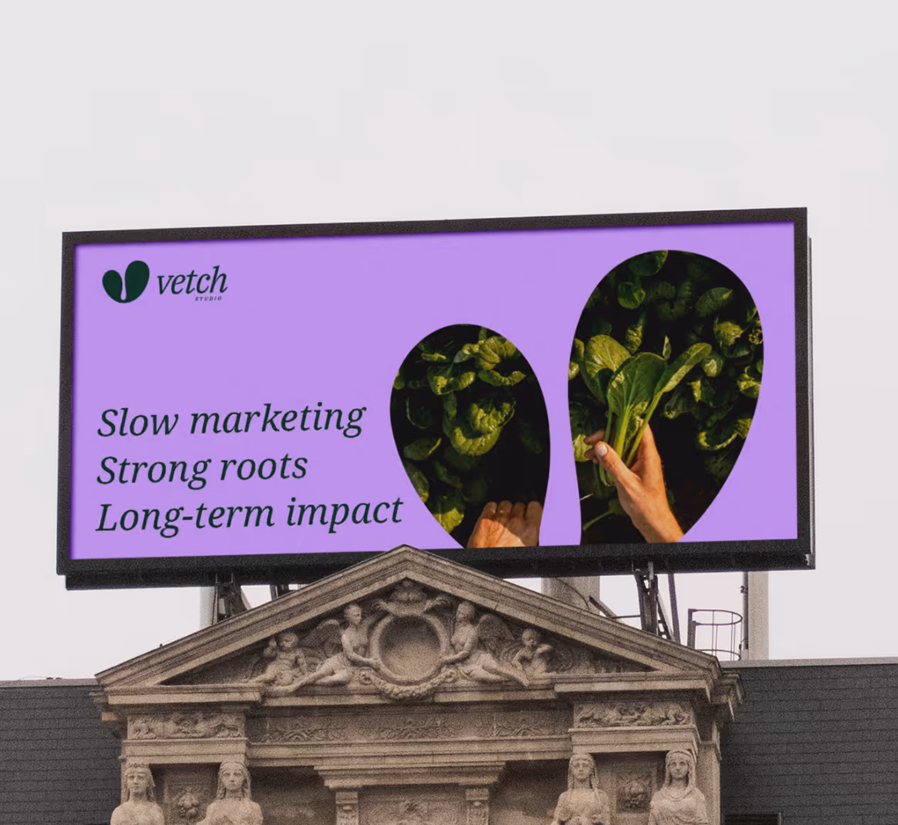 Billboard with purple background showing the text 'Slow marketing Strong roots Long-term impact' and a hand holding green leafy vegetables visible through two organic-shaped cutouts.