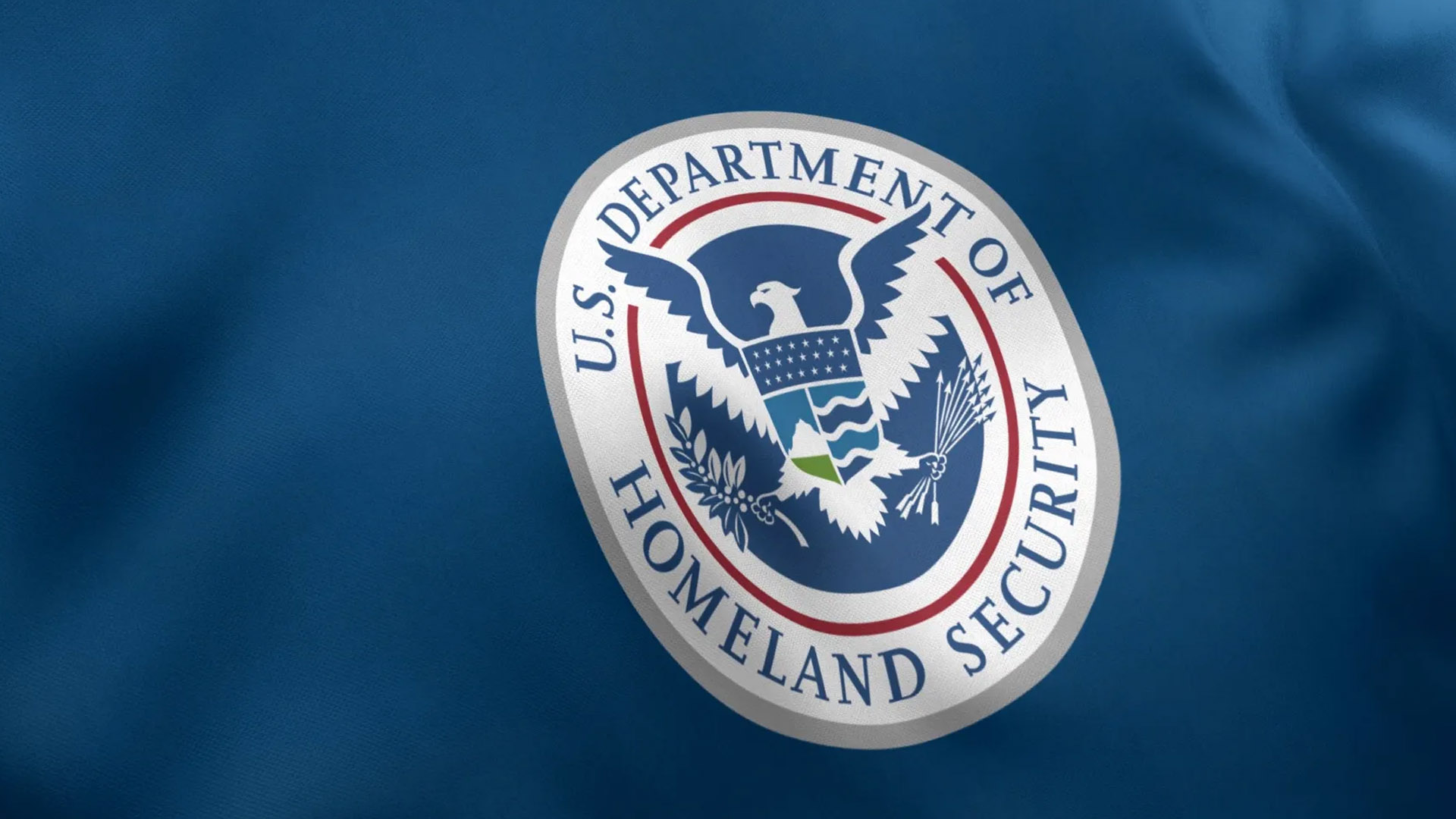 Department of Homeland Security seal on a blue flag, one year abroad rule removed for religious workers