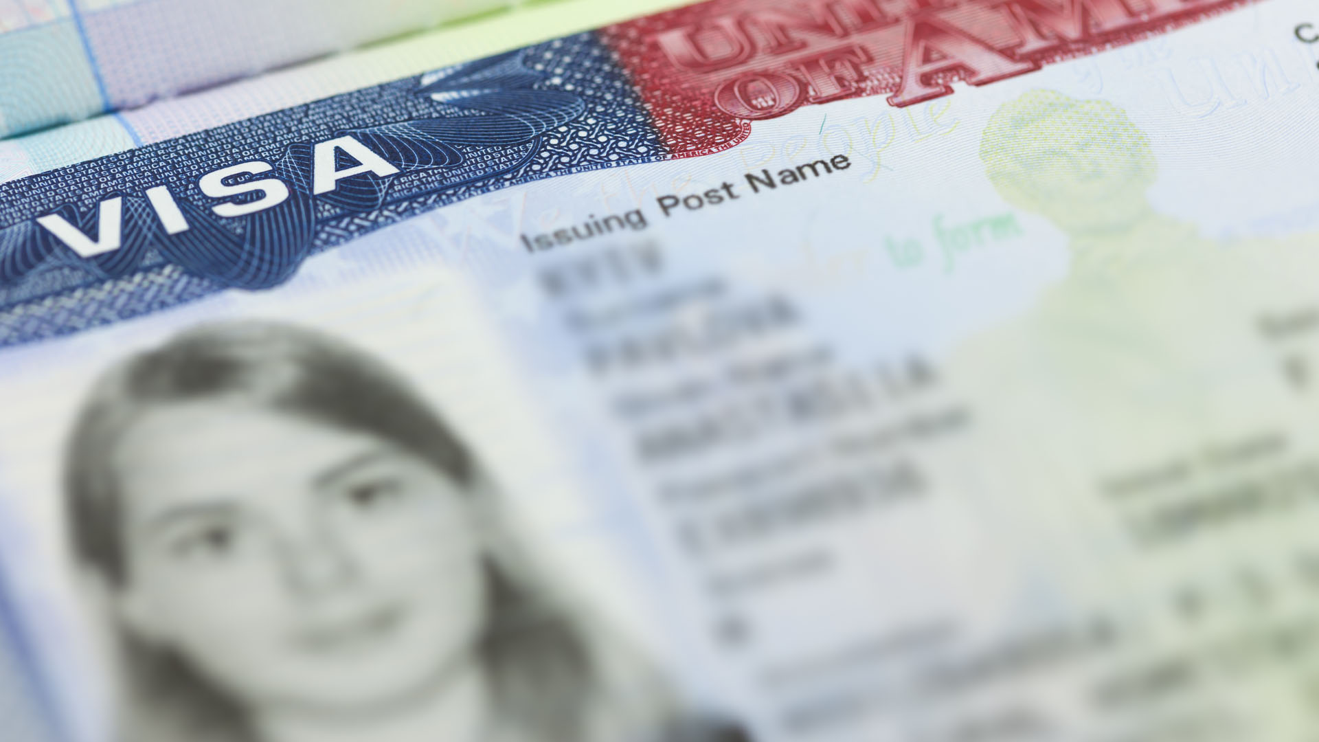 Close up of a US visa page with applicant photo, continuous vetting of visa holders